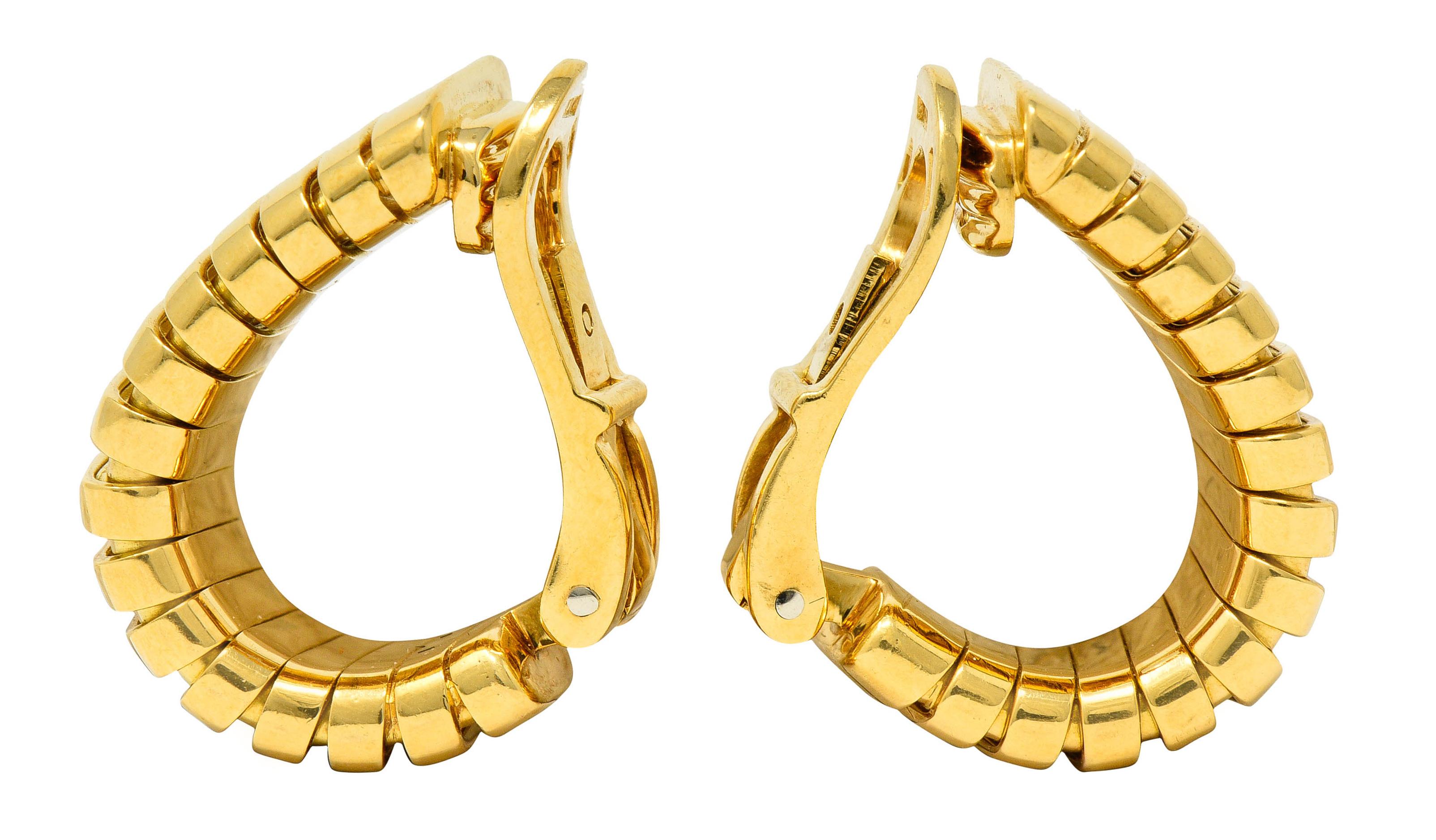 J hoop style earrings comprised of tubogas technology

Deeply ridged and brightly polished

Completed by hinged omega backs

With Italian assay marks for 18 karat gold

Fully signed Bvlgari

Circa: 1970s

Measures: 1/2 x 3/4 inch

Total weight: 21.5