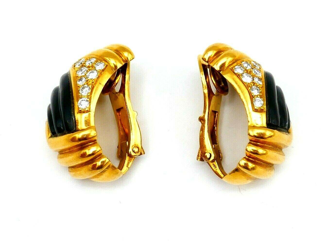 A beautiful vintage (1970s) pair of clip-on Bulgari earrings. Made of 18k yellow gold, features brown mother of pearl and diamond. Stamped with Bulgari maker's mark, a hallmark for 18k gold, a serial number and a place of origin