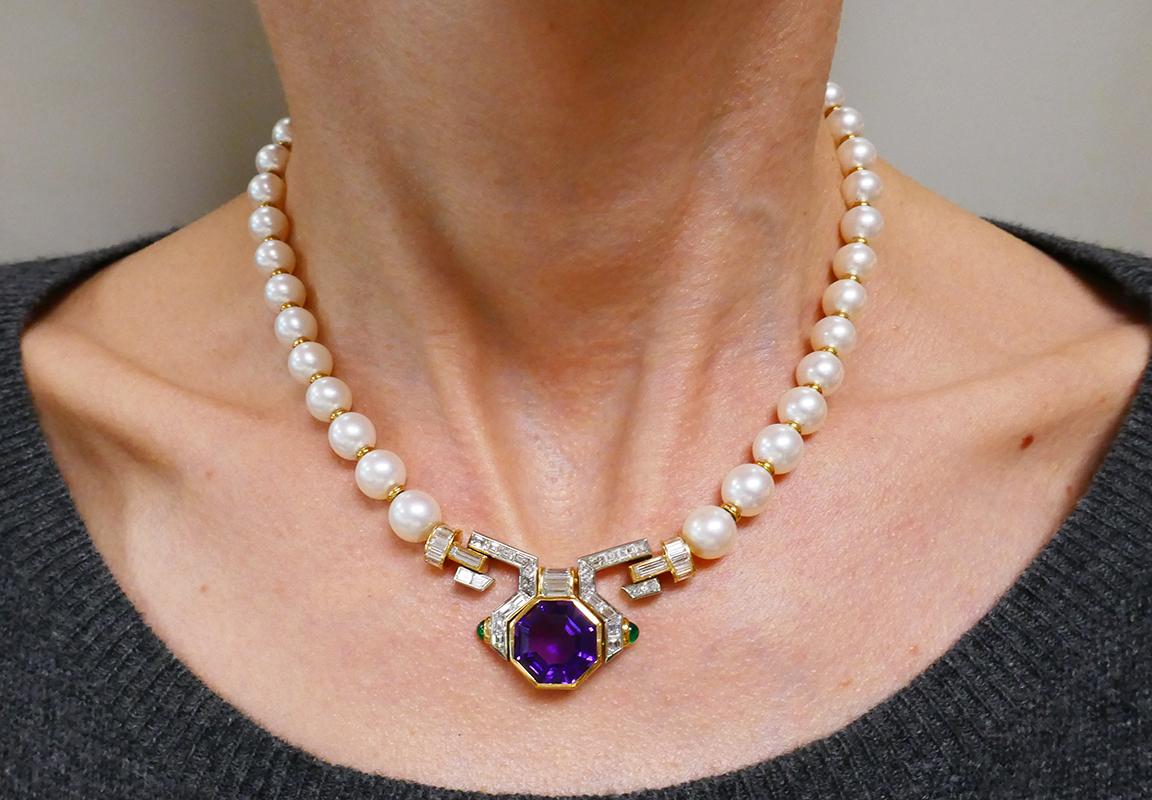        An outstanding Bulgari Akoya pearl amethyst diamond emerald 18k gold necklace.  
	A sparky architectural pendant is perfectly underlined with the shimmering pearls. This play of light creates an opulent feel of luxury. The contrast between