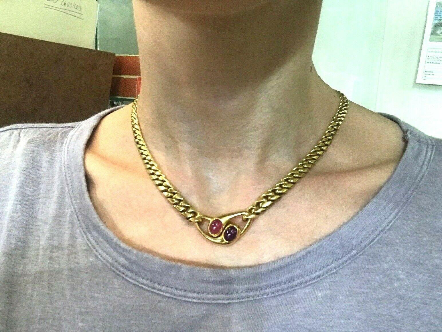 Gorgeous and wearable vintage Bvlgari necklace made of 18k yellow gold featuring cabochon amethyst and pink tourmaline. Timeless signature Bvlgari design at its best. 
Stamped with the Bulgari maker's mark, hallmarks for 18k gold and a serial