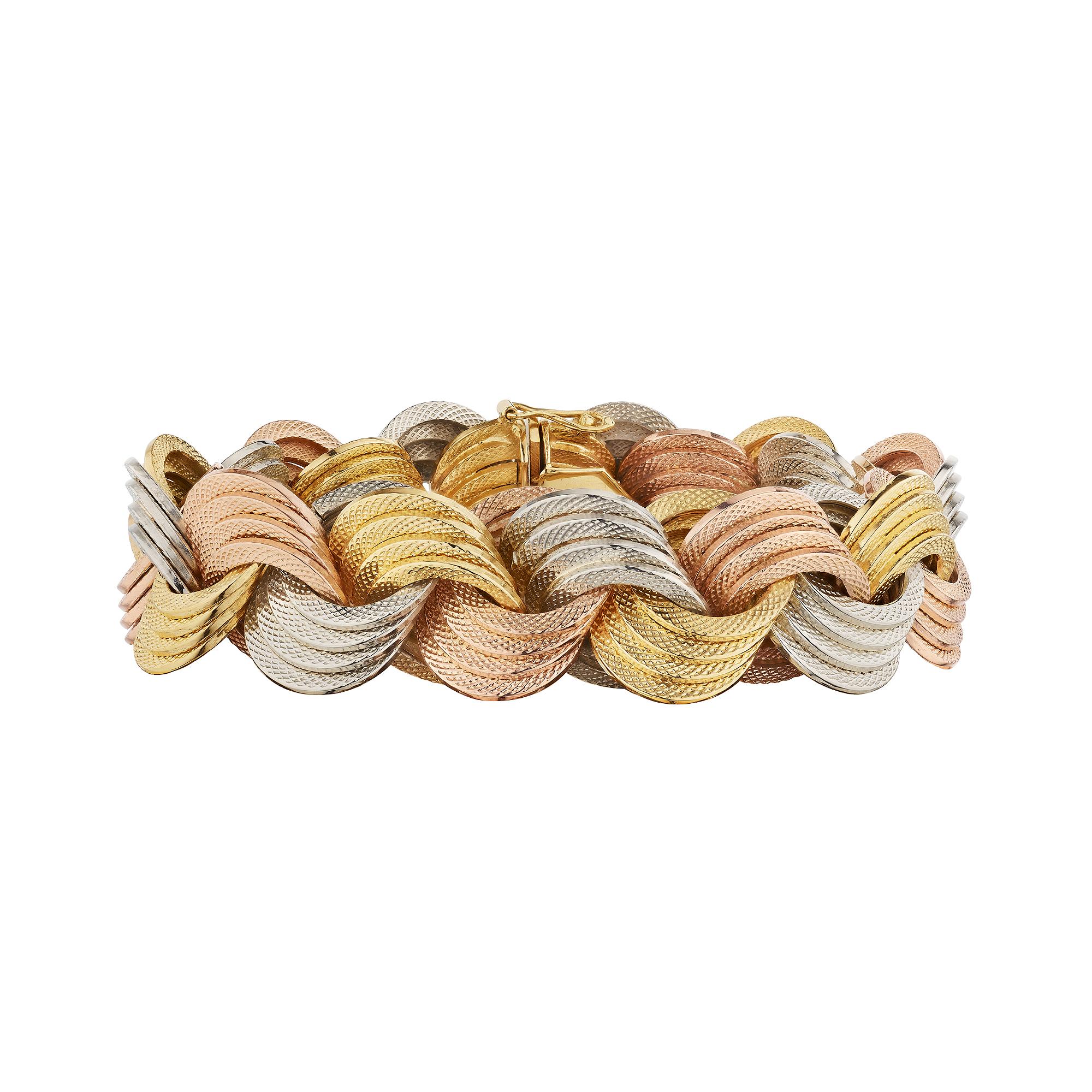 Eternally intertwined.  This Bulgari vintage rose, white, and yellow 18 karat gold bracelet, with interconnecting engraved triple circular links, will always keep you stylishly secured.  Signed Bulgari.  Circa 1970-75.  8 1/2 inch in length.    