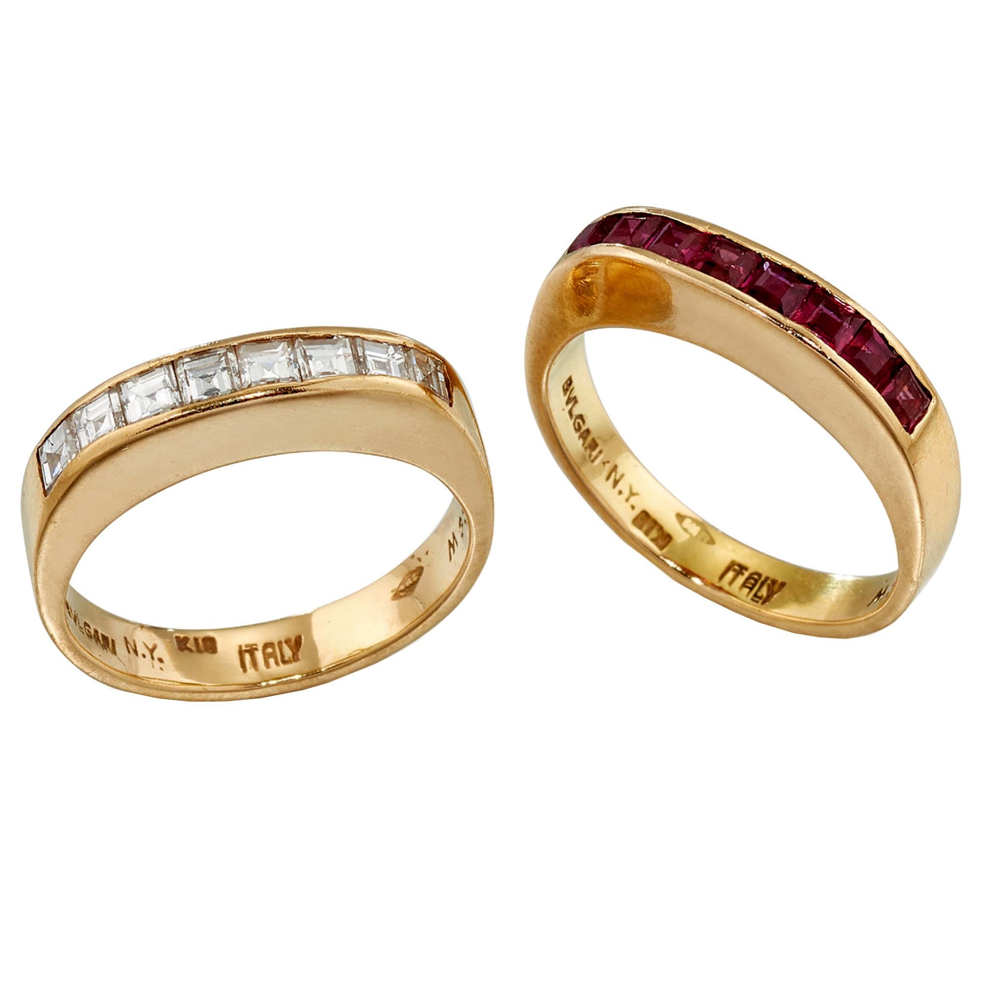 An impressive suite by Bulgari showcasing calibre cut rubies and carre cut diamonds set in timeless 18k yellow gold. The suite is circa 1980's. The rings measure a size 6 and 6 1/4 and can be resized.