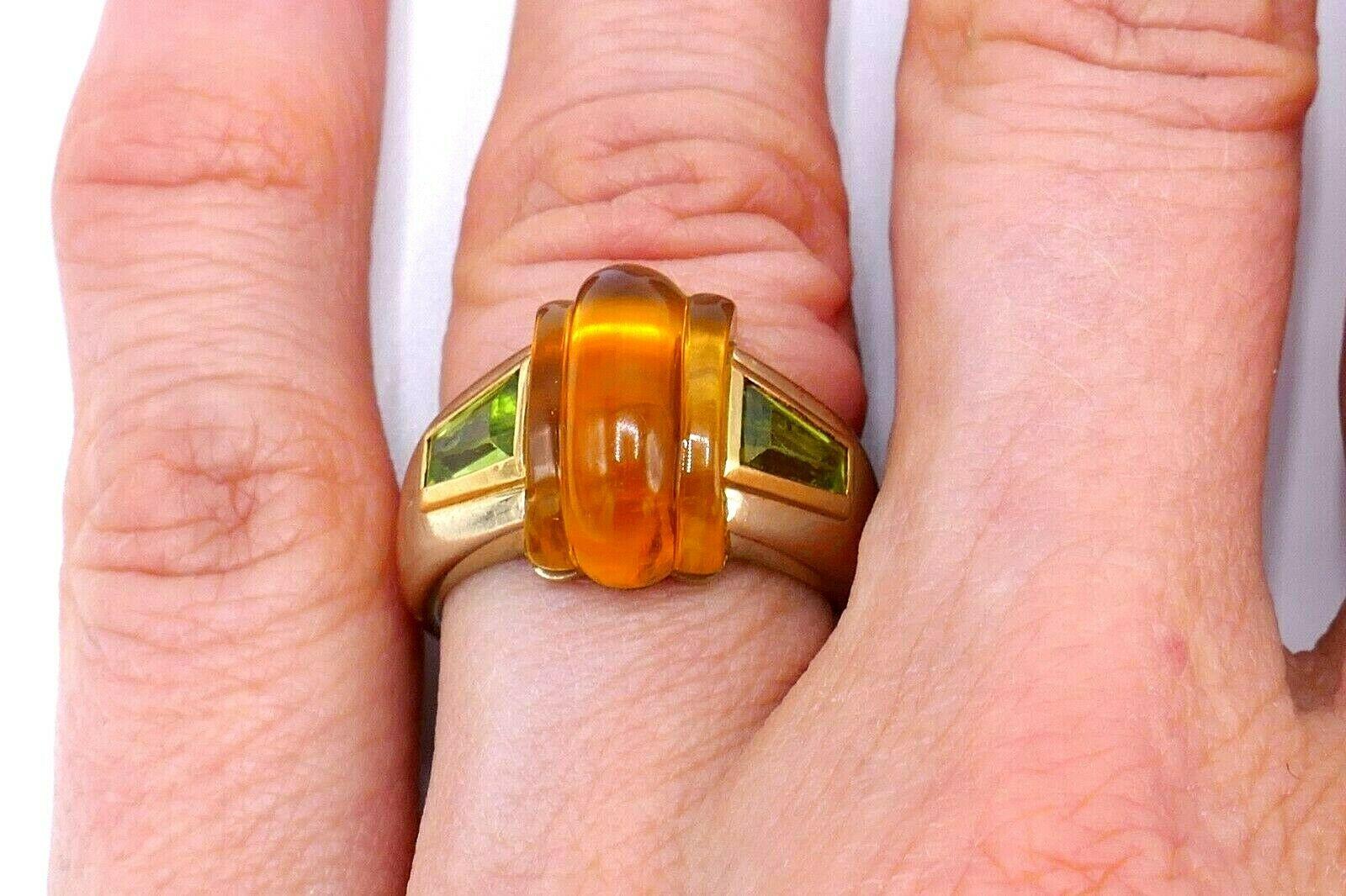 Amazing vintage ring by Bulgari made of 18k (stamped) white and yellow gold, featuring citrine and peridot. Stamped with the Bulgari maker's mark and a hallmark for 18k gold.
Measurements: the ring size is 5.5. Citrine's height is 1/2, width 3/8