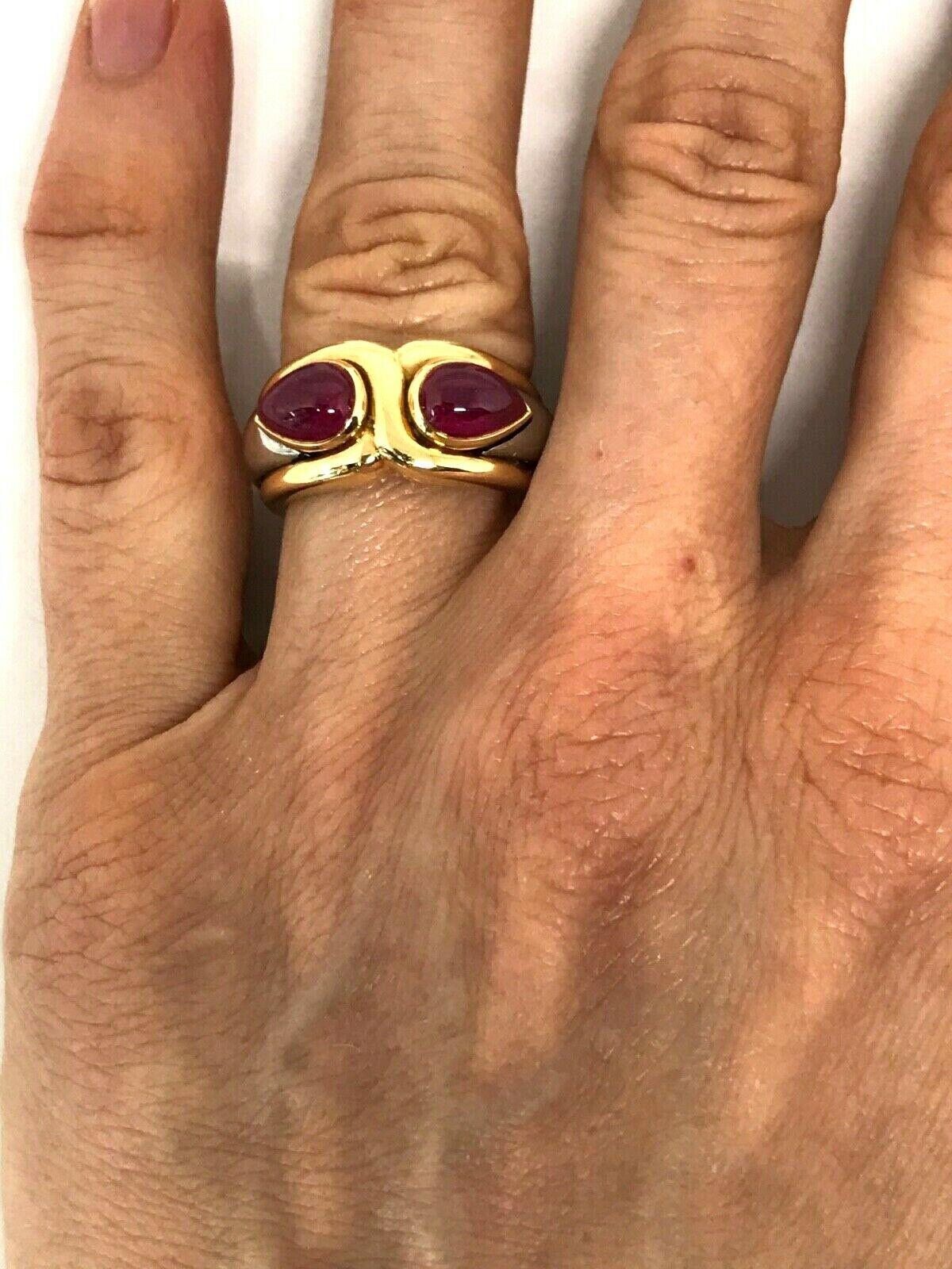 Stylish vintage 18k yellow gold ring by Bulgari features ruby and hematite. Rubies are cabochon cut, total weight is 3.69 carats (stamped). Stamped with the Bulgari maker's marks and a hallmark for 18k gold as well.
Measurements: the ring size is