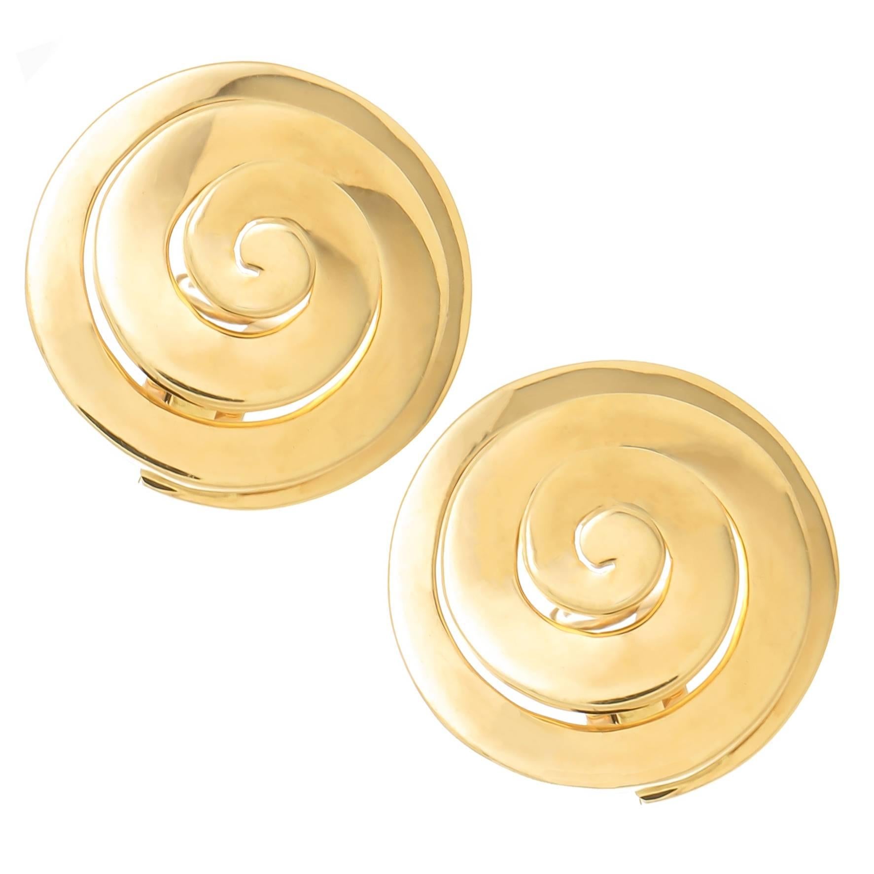 Circa 1980s Bulgari 18K yellow Gold earrings in a Swirl form, solid and having good weight and measuring just over 3/4 inch in diameter and 3/8 inch deep. having clip backs to which a post can be easily added if desired.