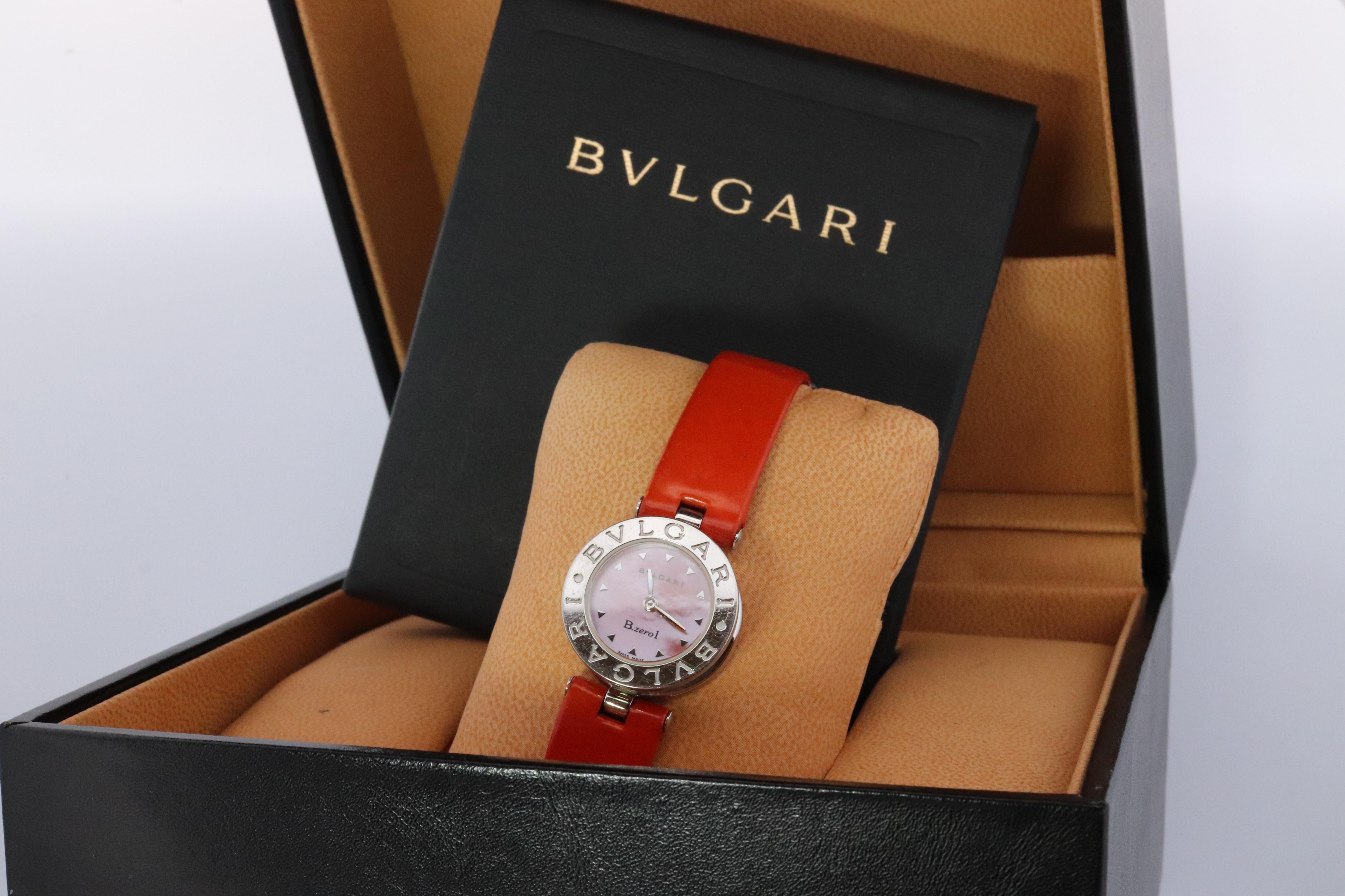 dGenuine BULGARI Ladies Watch
B.Zero1 BZ 22 S Orange MOP Watch.
22mm case
Quick deployment buckle. Original Bvlgari.
Condition: Shows some scratches and signs of wear.

Comes with Original Box and Original Papers.

New Battery Installed.

Guaranteed