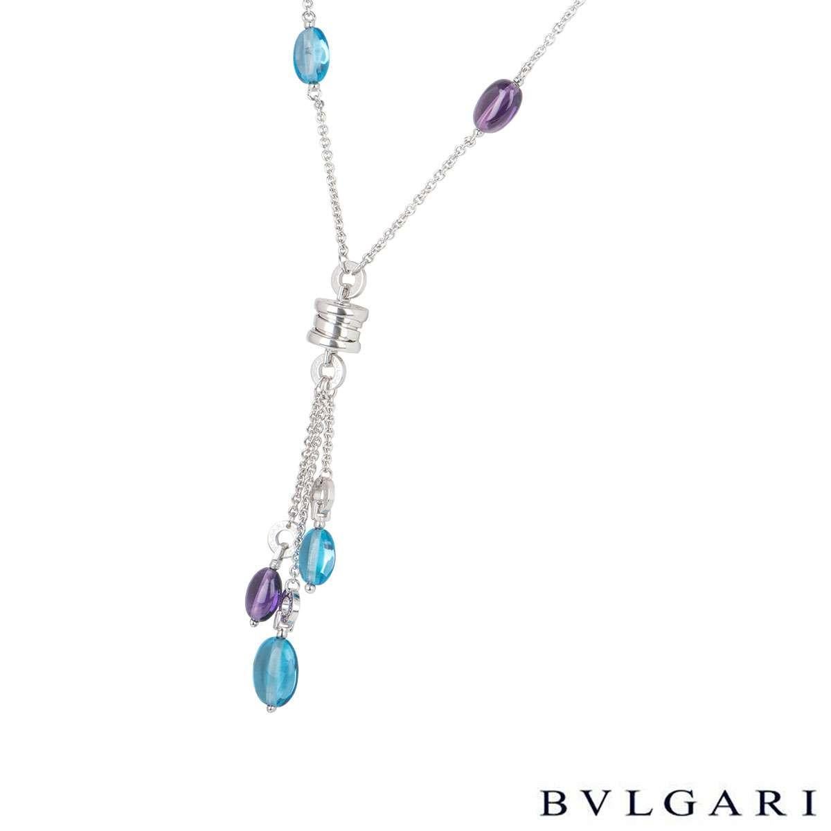 A beautiful 18k white gold amethyst and topaz Bvlgari necklace and earring suite from the B.zero1 collection. The necklace comprises of a single amethyst and topaz bead in the chain leading to the white gold B.zero1 motif. Suspended from the central