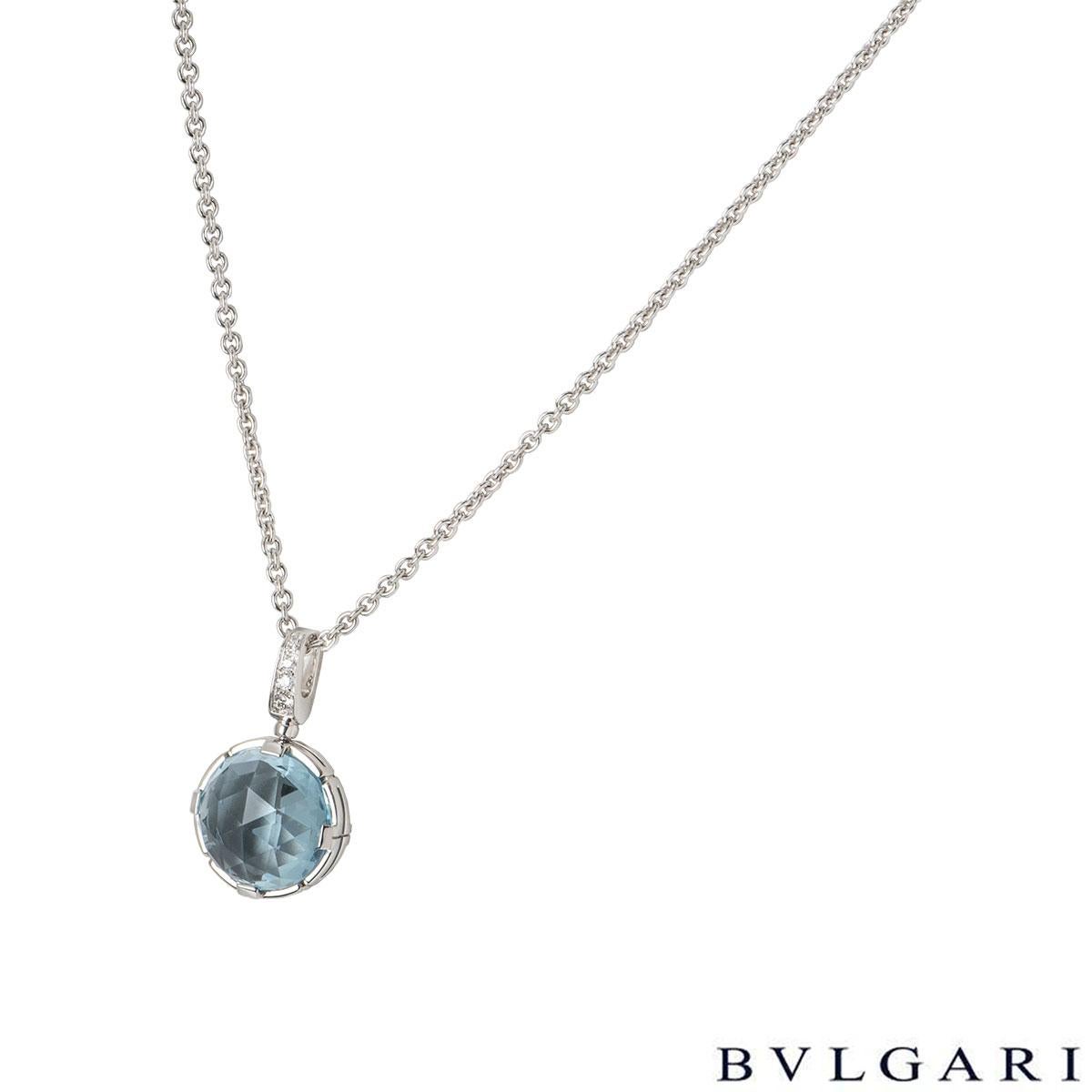 A stunning 18k white gold aquamarine necklace by Bvlgari from the Parentesi collection. The necklace comprises of a single round aquamarine with pave set diamonds on the loop bail 4 'Bvlgari Bvlgari' discs on the necklace. The 4 diamonds have an