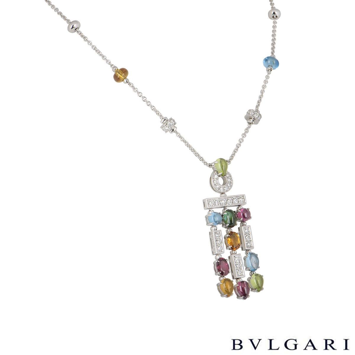 A stunning 18k white gold multi-gem suite by Bvlgari from the Allegra collection. The necklace features round brilliant cut diamonds along with peridot, amethyst, citrine, garnet, topaz and tourmaline in a mixture of different cuts. One earring is