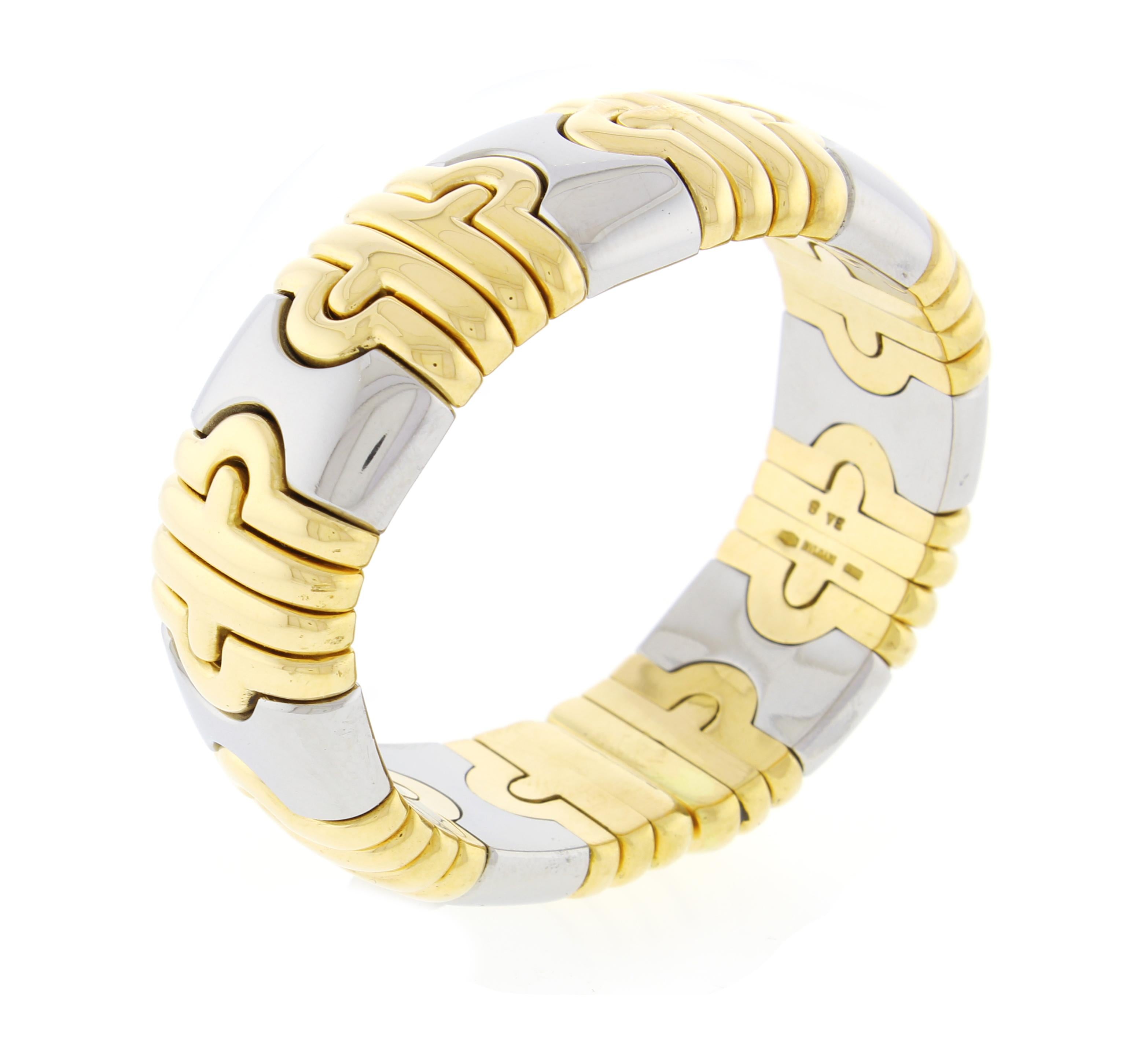From Bulgari's Parentesi collection, a 20mm wide  flexible cuff bracelet
♦ Designer:Bulgari
♦ Metal: 18 karat white and yellow gold
♦ 20mm wide
♦ 53mm inside diameter
♦ Circa 2000
♦ 113.6grams
♦ Packaging: Pampillonia presentation box 
♦ Condition: