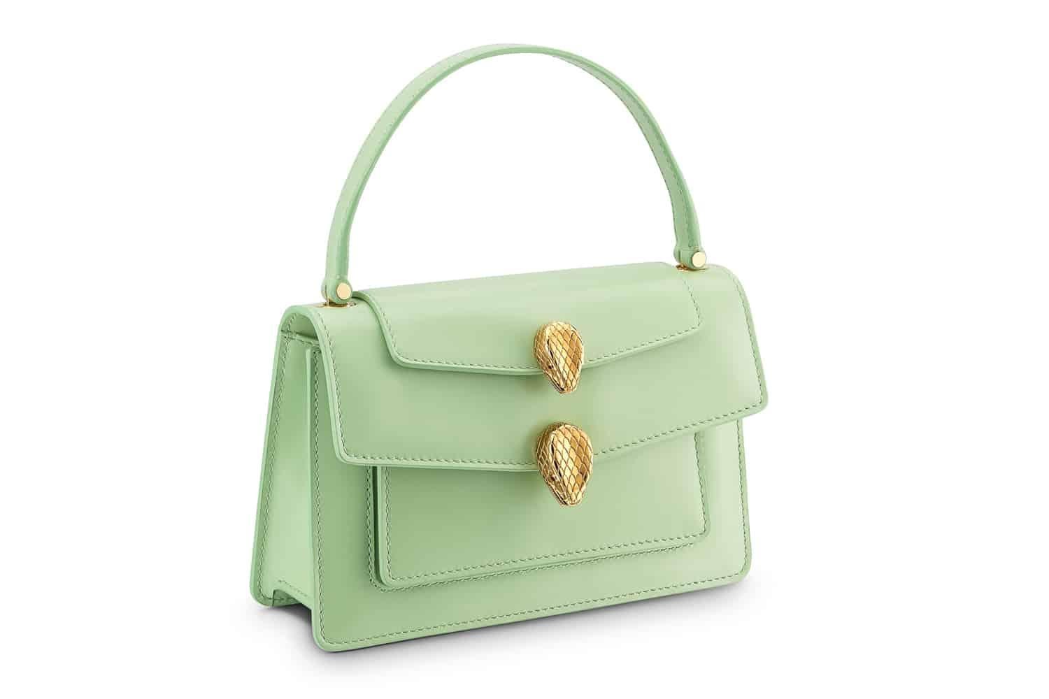 This is an authentic BULGARI x ALEXANDER WANG Calfskin Serpenti Top Handle Belt Bag in Light Green. This chic crossbody is crafted of light green leather. It features a light gold plated sinuous snake chain with a leather shoulder pad, a matching