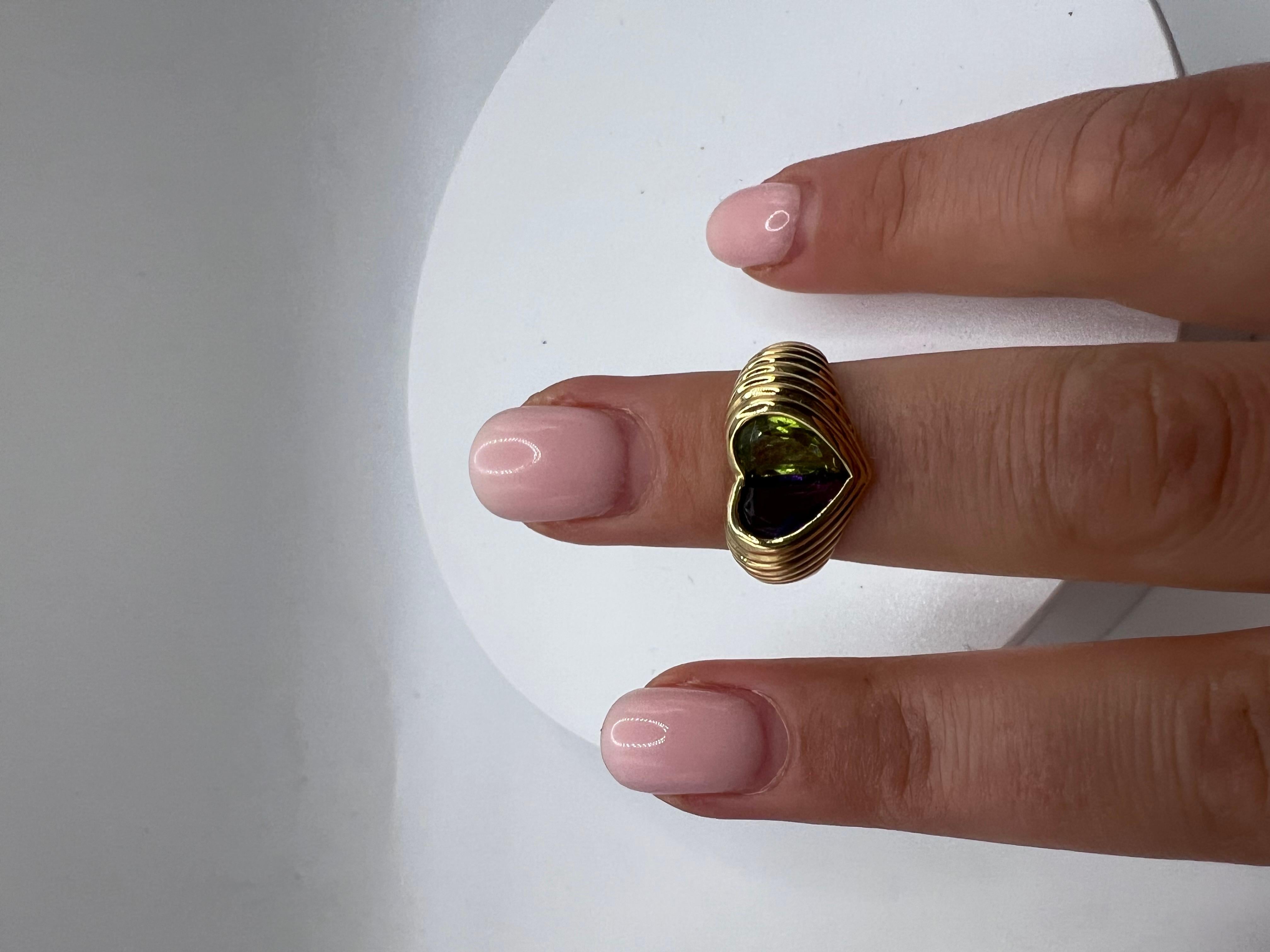 This is an 18kt Gold Amethyst and Peridot Signed Bvlgari Size 6Ring. Crafted with precision and elegance, this stunning piece showcases the vibrant colors of amethyst and peridot, making it a timeless addition to your jewelry collection. 
