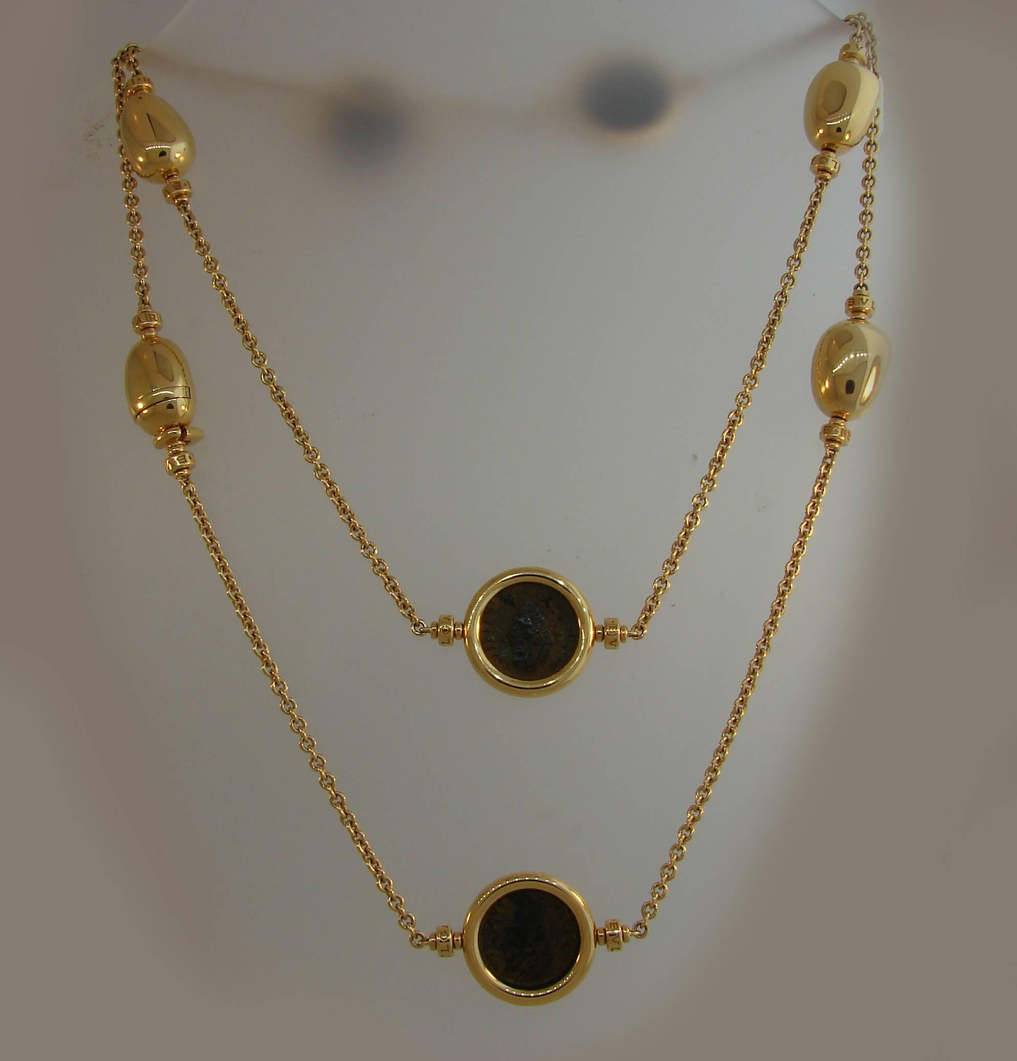 Unusual Bulgari coin necklace featuring four ancient Roman bronze coins. Trendy, elegant and wearable, the necklace is a great addition to your jewelry collection.
The coins are 5/8 inch (1.6 cm) in diameter, and dated A.D. 337-408. The rest of the
