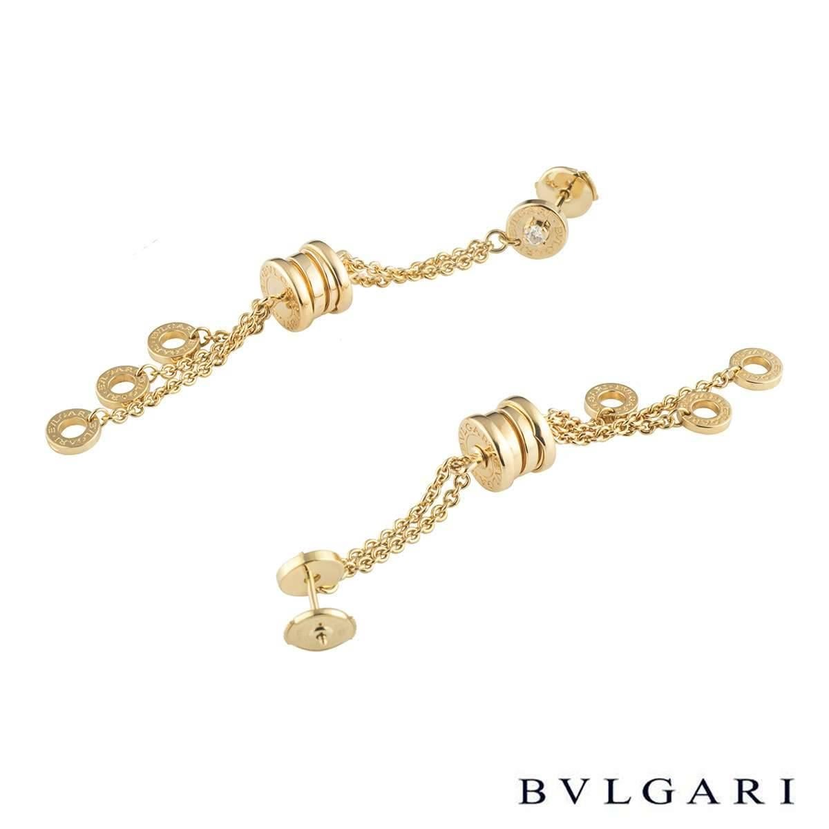 A beautiful pair of 18k yellow gold Bvlgari drop earrings from the B.Zero1 collection. The earrings each comprise of a circular motif with a round brilliant cut diamond in a 4 claw setting. Leading from this motif are 2 cable chain tassels