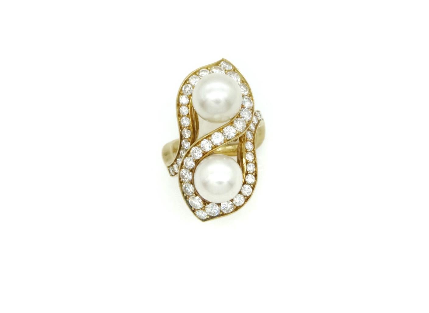 Elegant Bulgari 18 karat yellow gold, diamonds (appx 9 carats total), and pearl earrings & ring set, circa 1980.