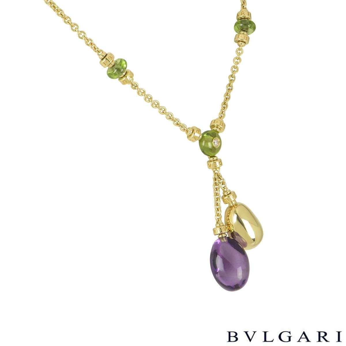 A beautiful 18k yellow gold Bvlgari multi gemstone necklace from the Mediterranean Eden collection. The necklace comprises of the centre of the necklace with a cabochon cut peridot with a 0.07ct, G colour and VS clarity round brilliant cut diamond