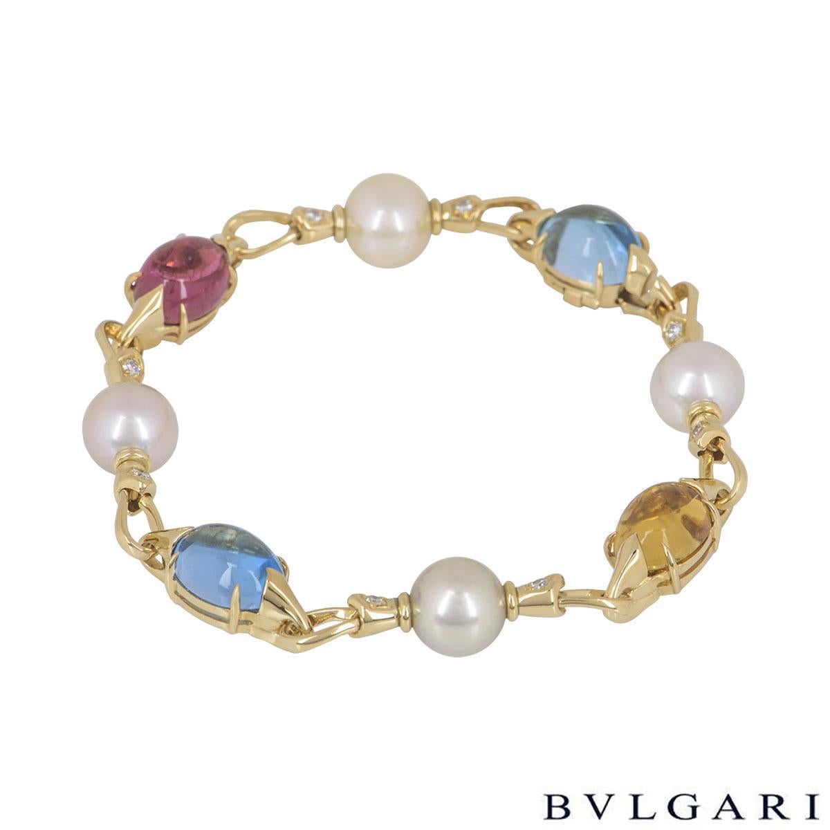 An 18k yellow gold pearl and multi-gem bracelet by Bvlgari from the Allegra collection. The bracelet comprises of pear shaped cabochon topaz, citrine and tourmaline alternating with round cultured pearls and single round brilliant cut diamonds on