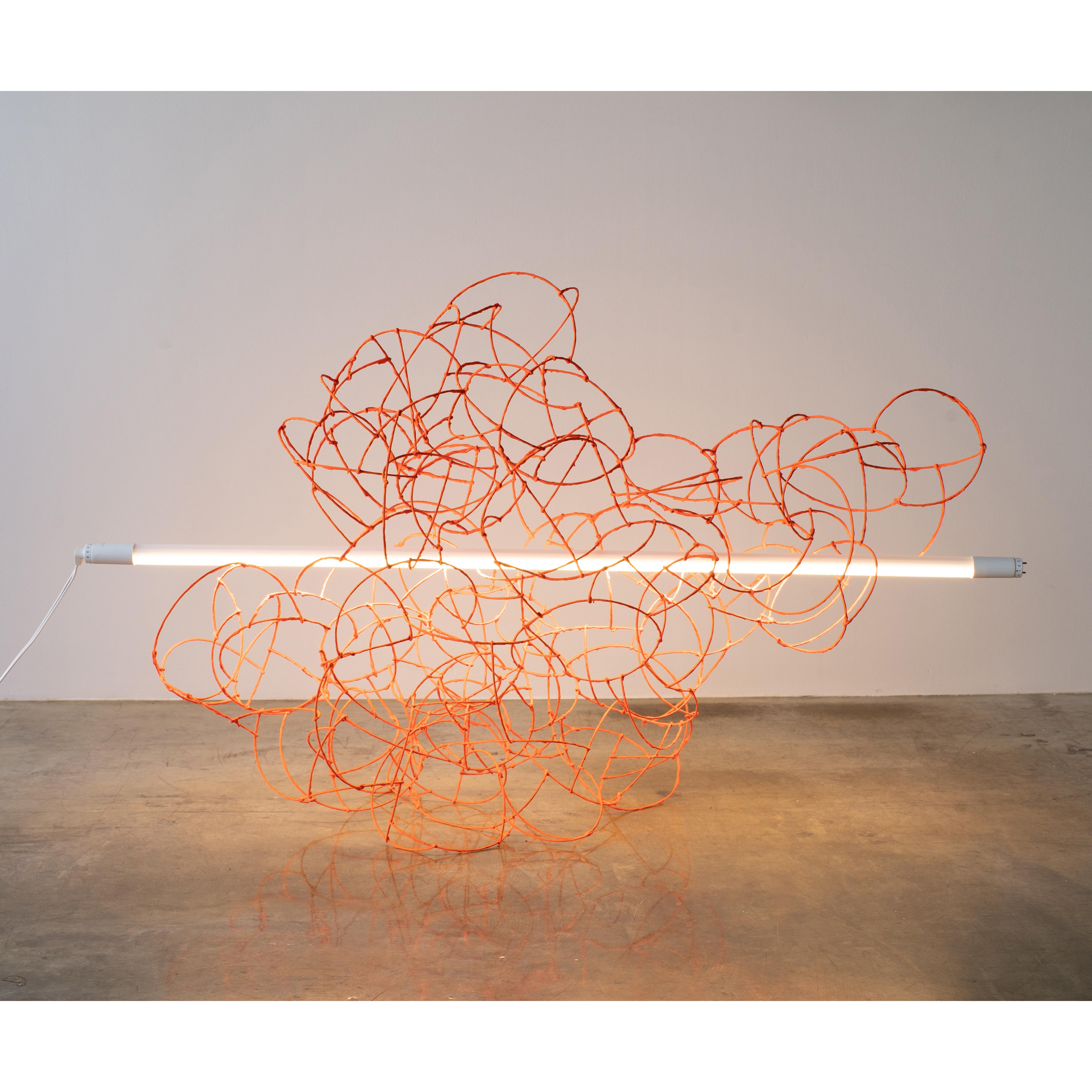 Bulge Lines: Fluorescent lamp orange.

This sculptural lighting is made of mainly a lot of wires bonded each. LED florescent light penetrate through wire sculpture. While putting, this piece is sometimes weighted down due to its material