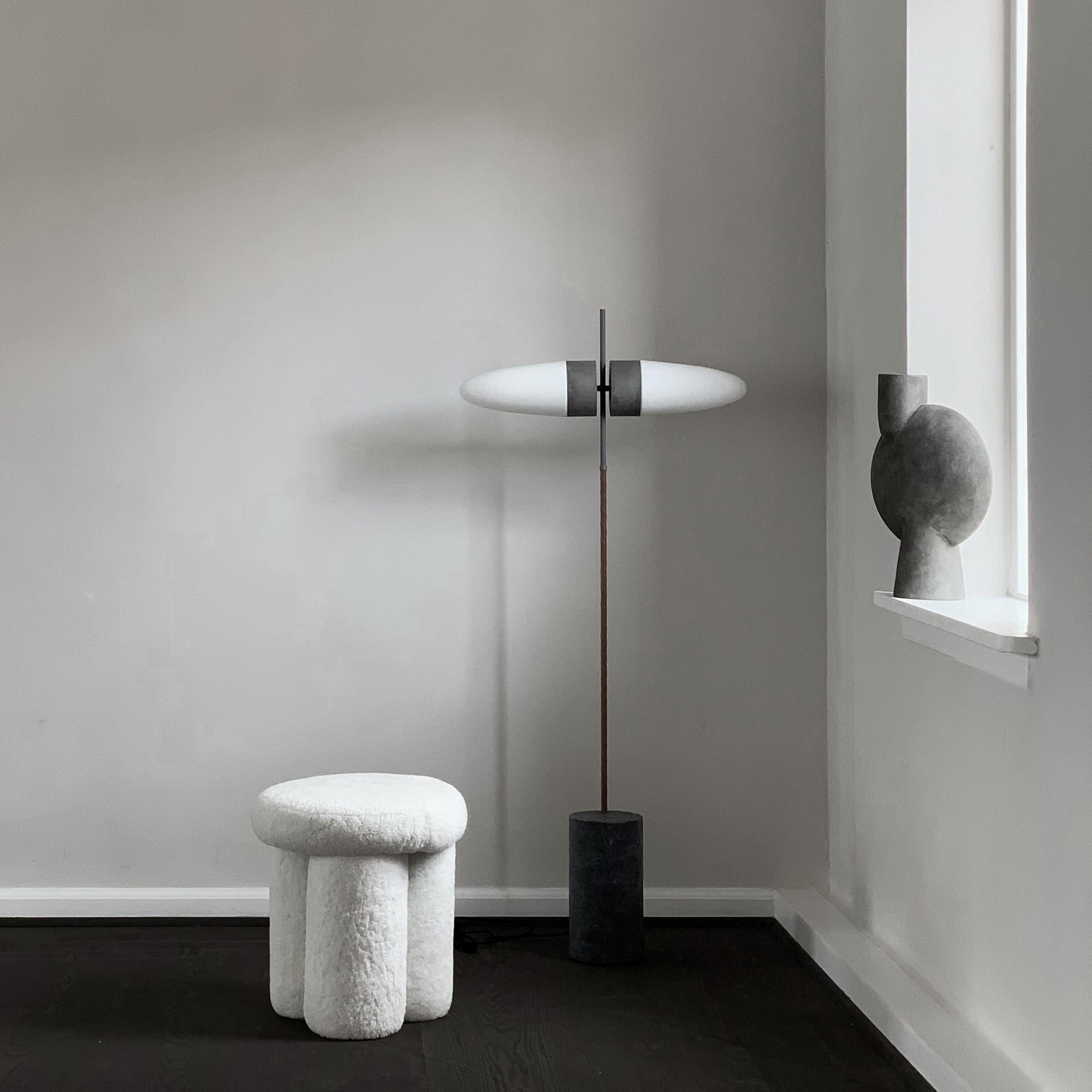 Bull floor lamp by 101 Copenhagen
Designed by Kristian Sofus Hansen & Tommy Hyldahl.
Dimensions: L 65 x W 16 x H 140 cm
Cable length: 200 cm

Materials: metal: aluminum / oxidized
Opal glass / white
Leather / cognac
Cable: fabric covered