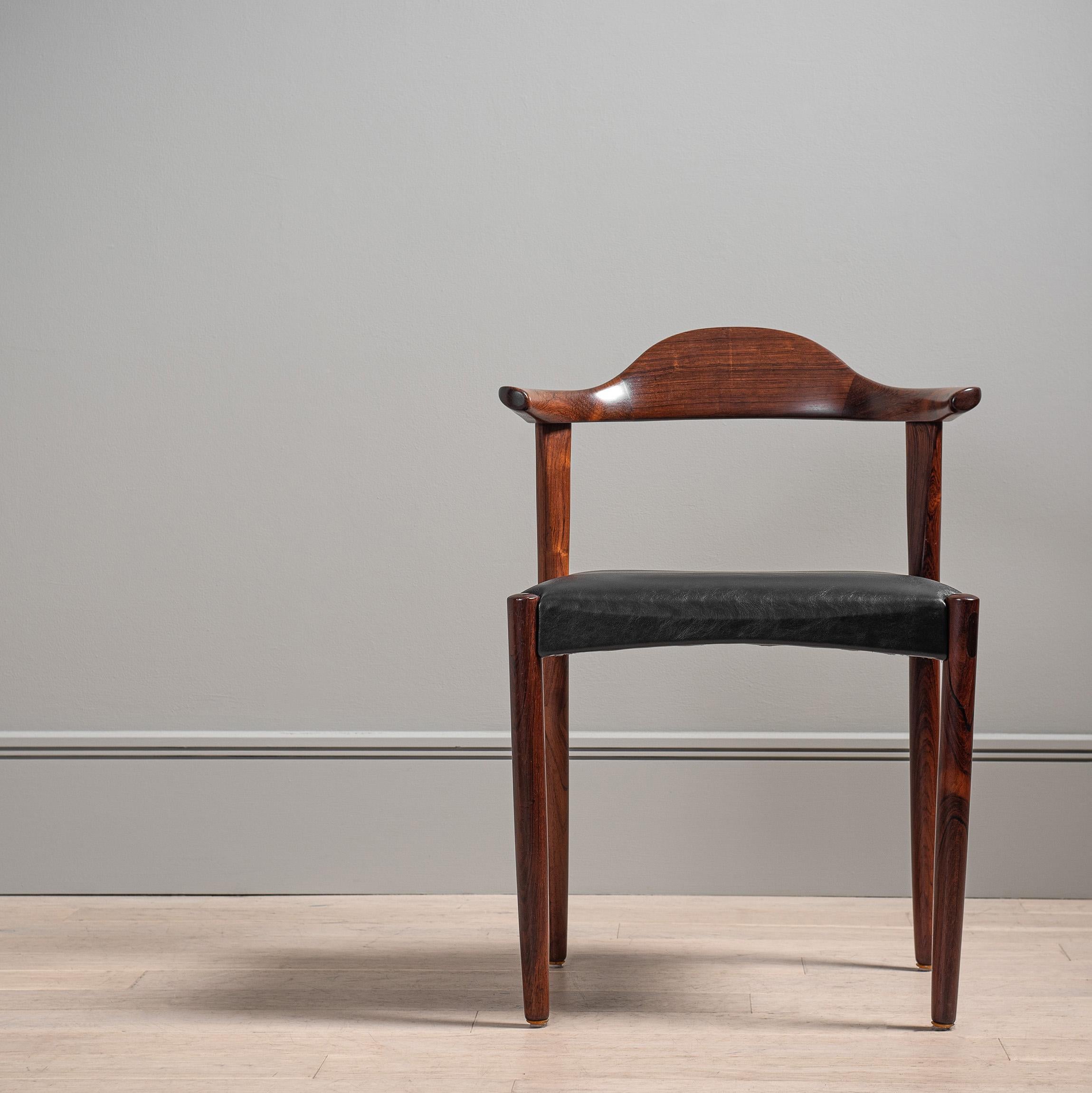 An absolutely stunning chair design by Jacob Herman and executed perfectly by Randers, Denmark circa 1950's. Wonderful curved sculptural bull-horn arms and backrest. The craftsmanship is outstanding. Soft black new leather upholstery.
