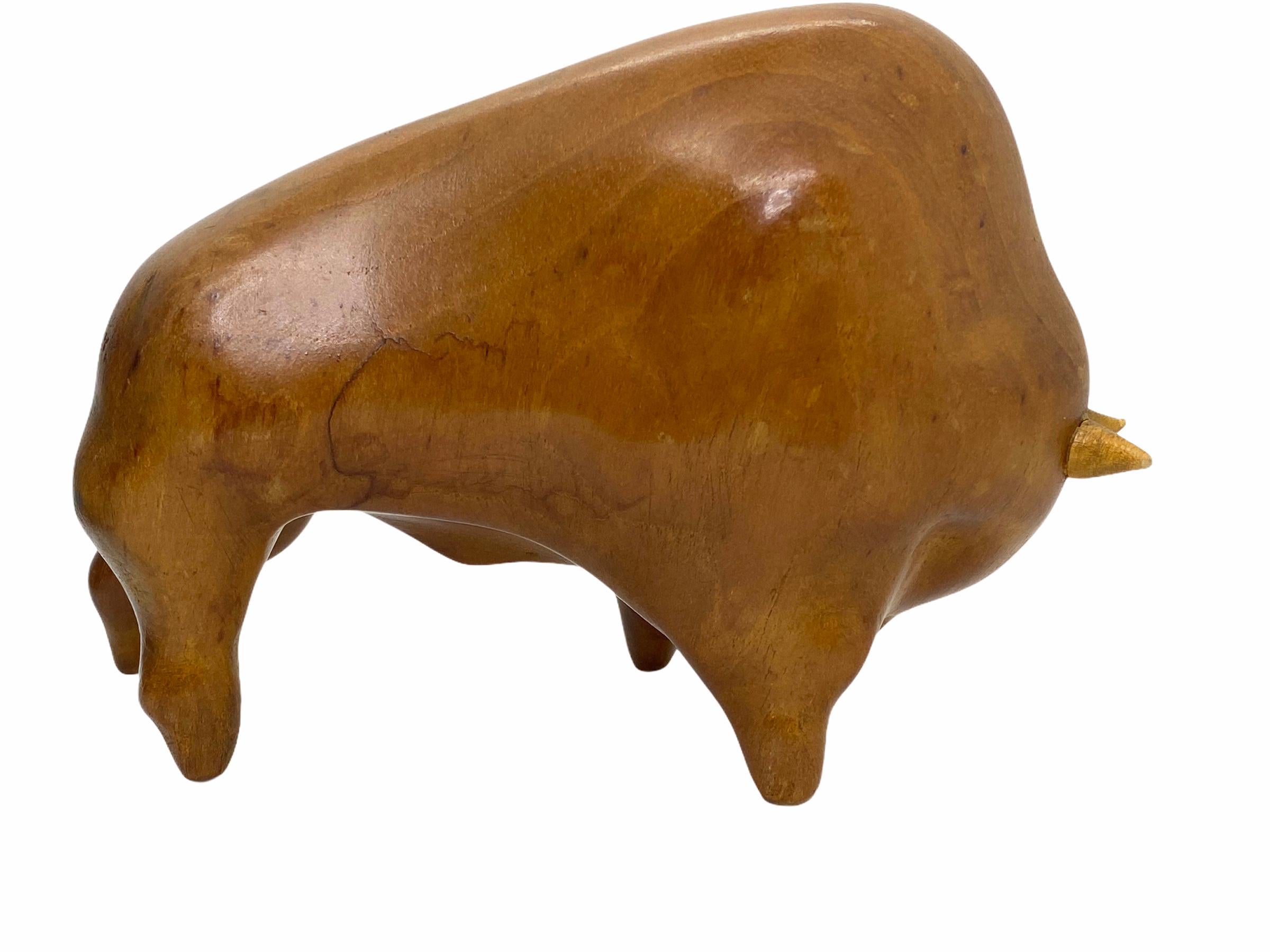 Classic early 1960s Danish design wood bull sculpture. Nice addition to your table or just for your collection of design items. Made of wood. Found at an estate sale in Vienna, Austria.