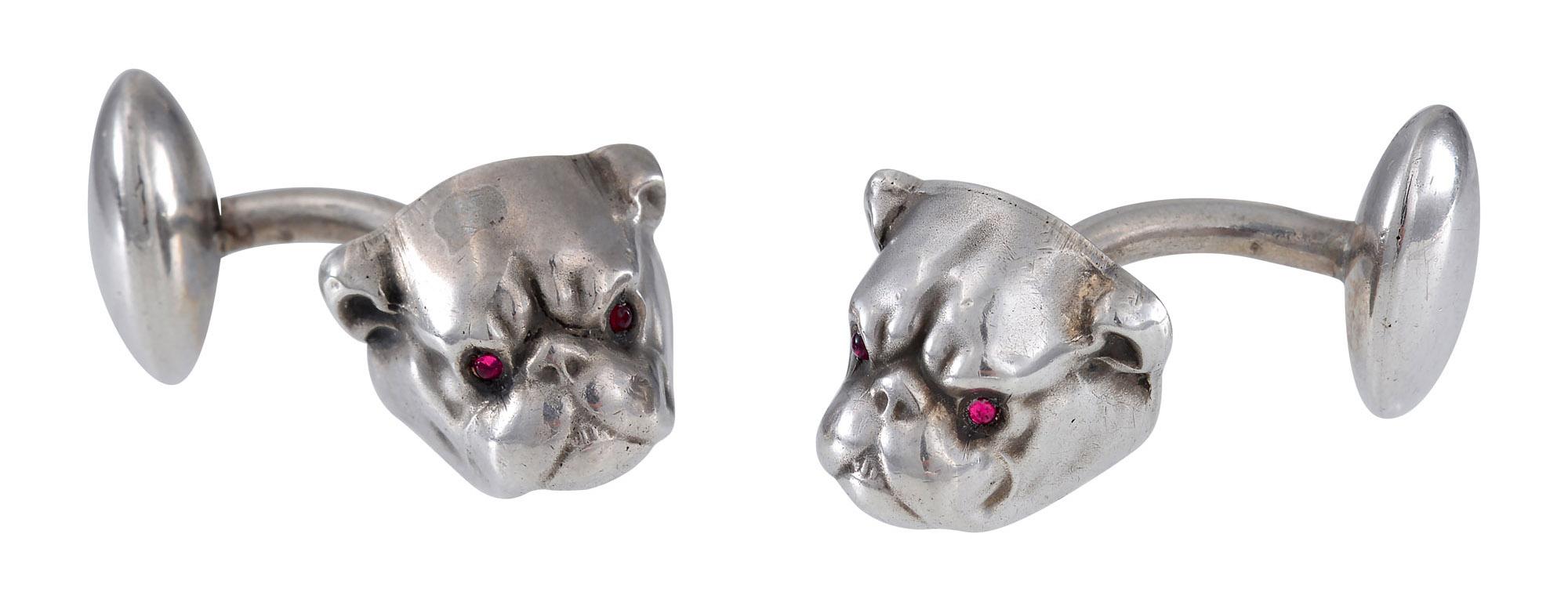 The most delightful pair of Bulldog cufflinks with red cabochon stone eyes .Marked for Unger Brothers , Newark 1872 -1919  .One cufflink weighs 3.1 grams and  the other 3.3 grams.