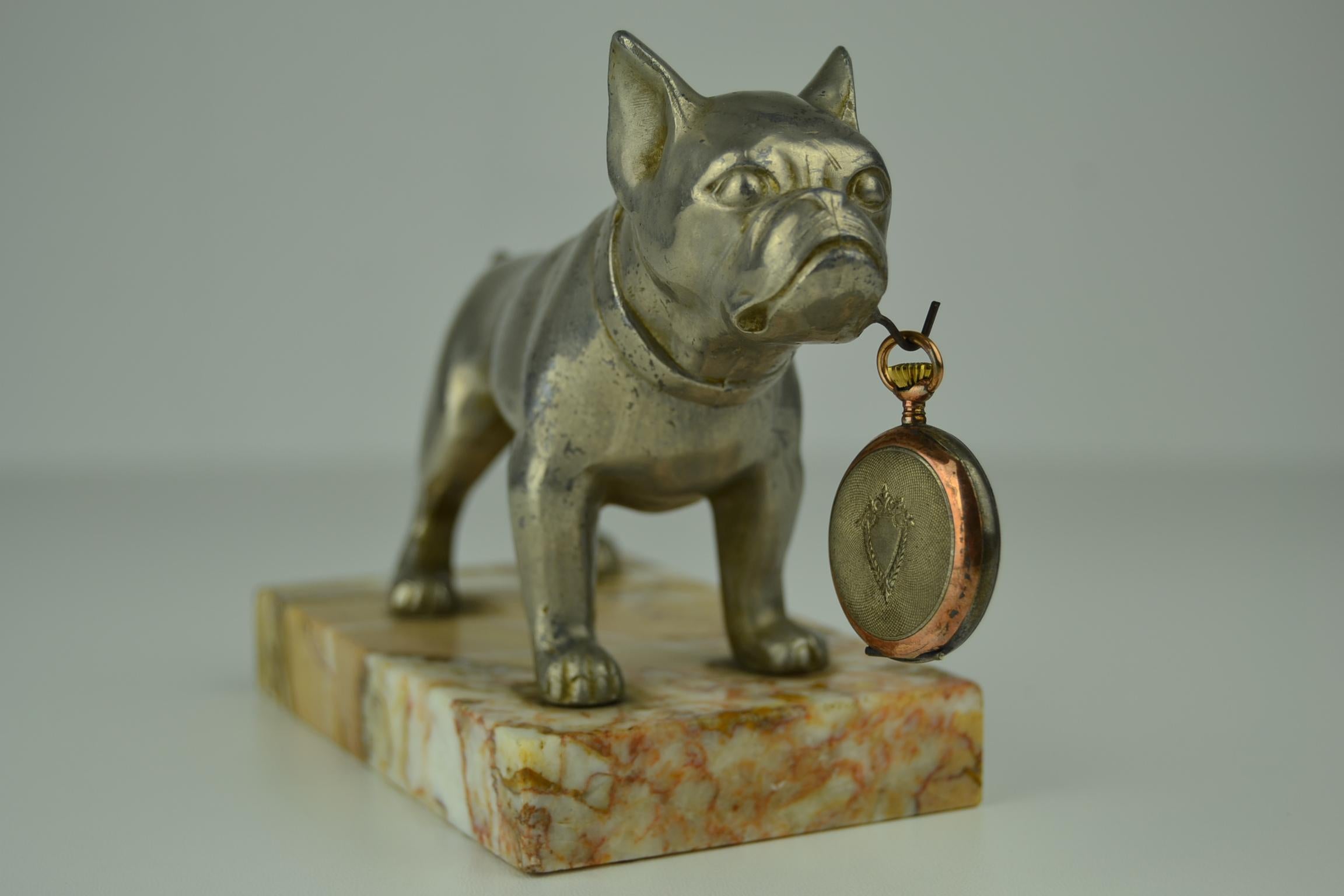 Art Deco dog figural pocket watch holder, dog watch holder, pocket watch stand mounted on marble base.
Silver metal standing bulldog, French bulldog, frenchie, dog figurine 

The pocket watch is not very old, but will be added just as