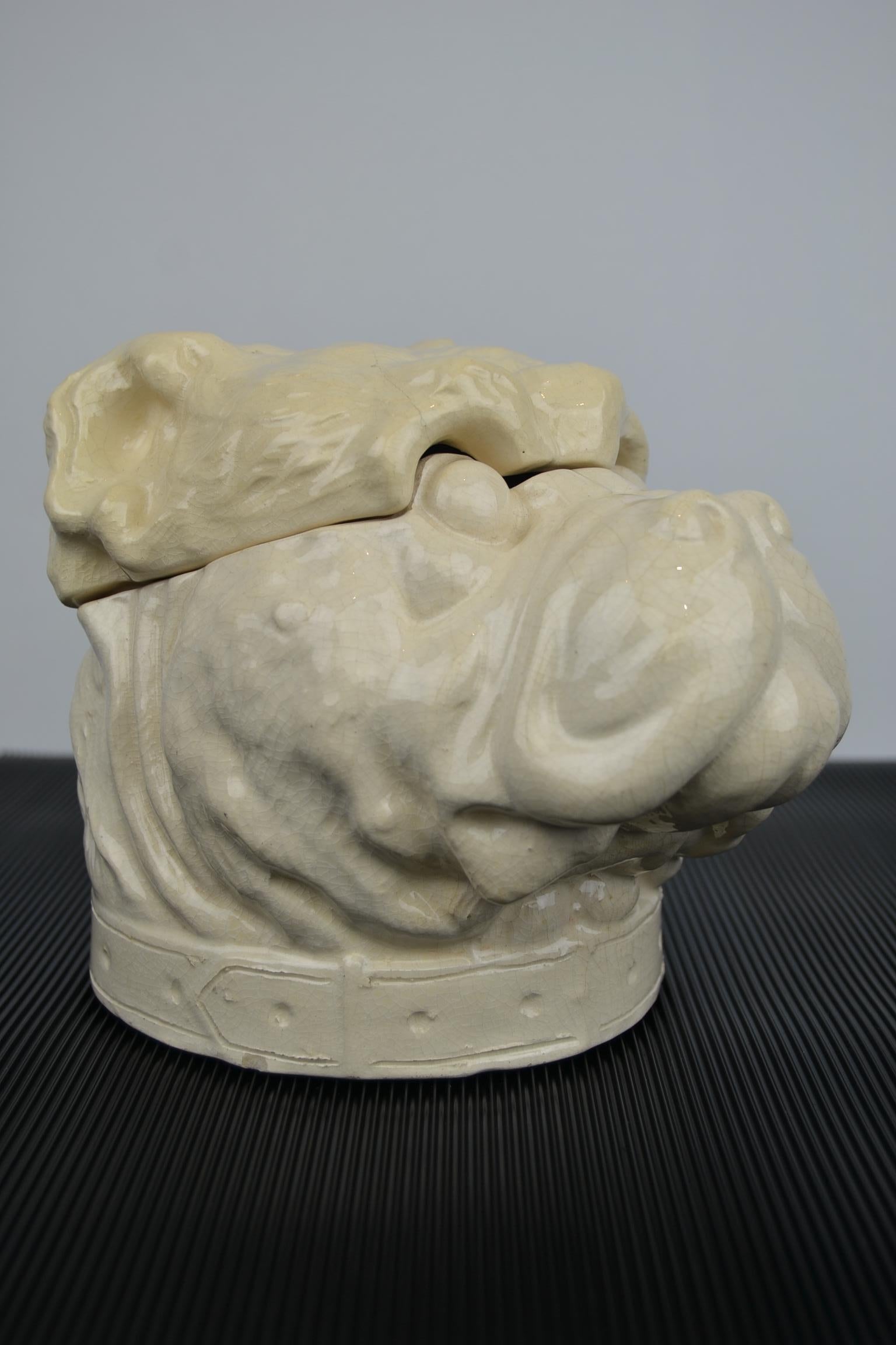 Stunning large porcelain tobacco pot - Tobacco Jar - Humidor in the shape of a Dog - Bulldog.
This Art Deco porcelain craquelé jar is very detailled and consists of two pieces:
the jar and the skull of the head.
It was made in Belgium by L.A.B,