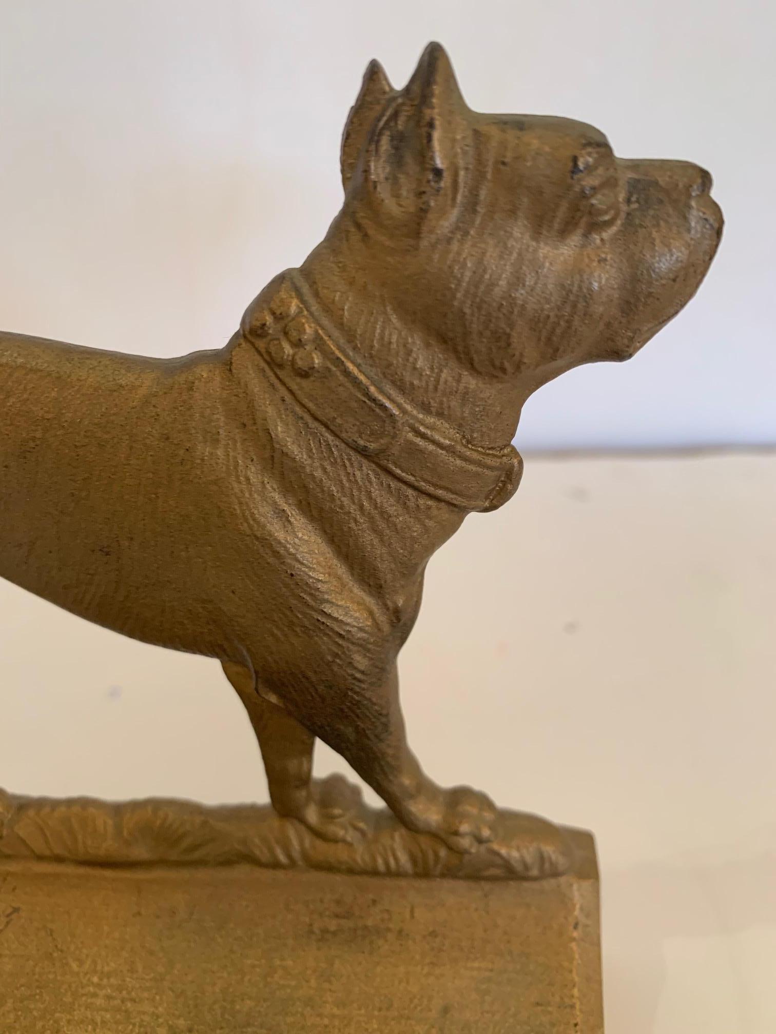 Irresistible pair of antique gilt iron bookends in the shape of bulldogs.