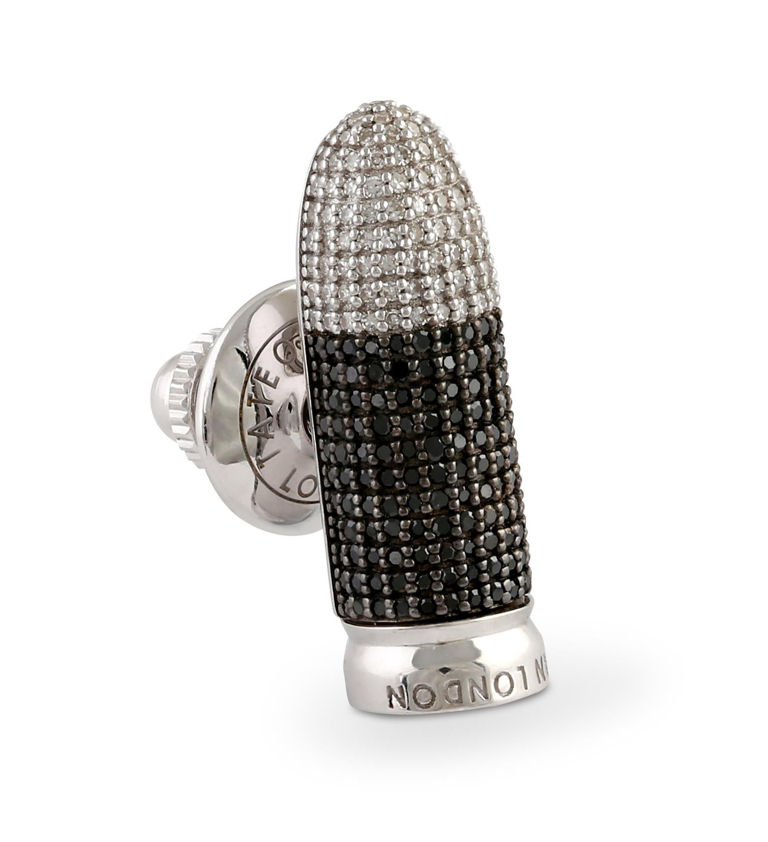 This edgy, minimalistic and uber cool design features 180 black (0.491 cts), and 95 white (0.234 cts) pave diamonds, covering the entire surface of the bullet. This glamorous pin is the epitome of luxury and a perfect companion when you want to make