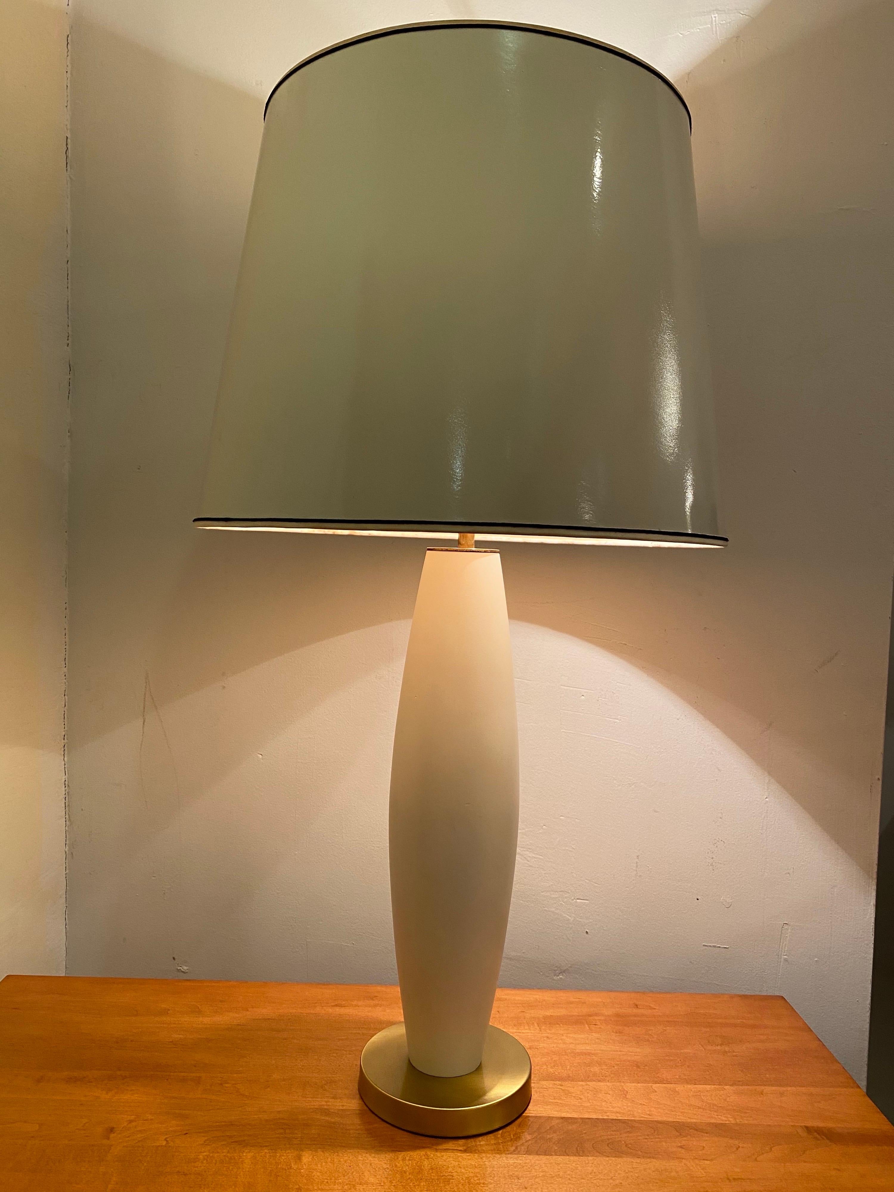 Bullet shaped table lamp with a round satin brass base. 3 pull chain sockets control the amount of light. Lamp is in great shape, appears that the lamp was repainted and brass polished within the last 10 years. Overall in great shape.