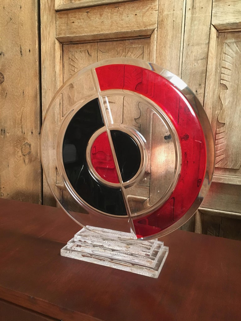 Bullseye Lucite sculpture signed by Shlomi Haziza.

Haziza started as a painter and later began to explore new mediums. He ran a small studio in his hometown. Later on he started his journey to Los Angeles. Which in turn, presented a leading art