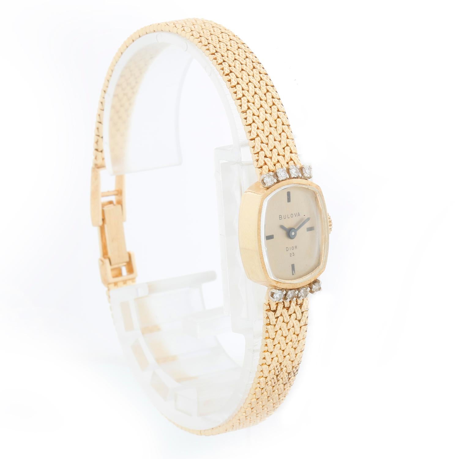 Bulova Vintage 14K Yellow Gold Ladies Watch - Manual. 14K Yellow gold case; Oval shaped with diamond lugs ( 21 mm ). Champagne dial with stick hour markers. 14K yellow gold band; measures 6 1/2 inch wrist. Pre-owned with custom box. #64305

