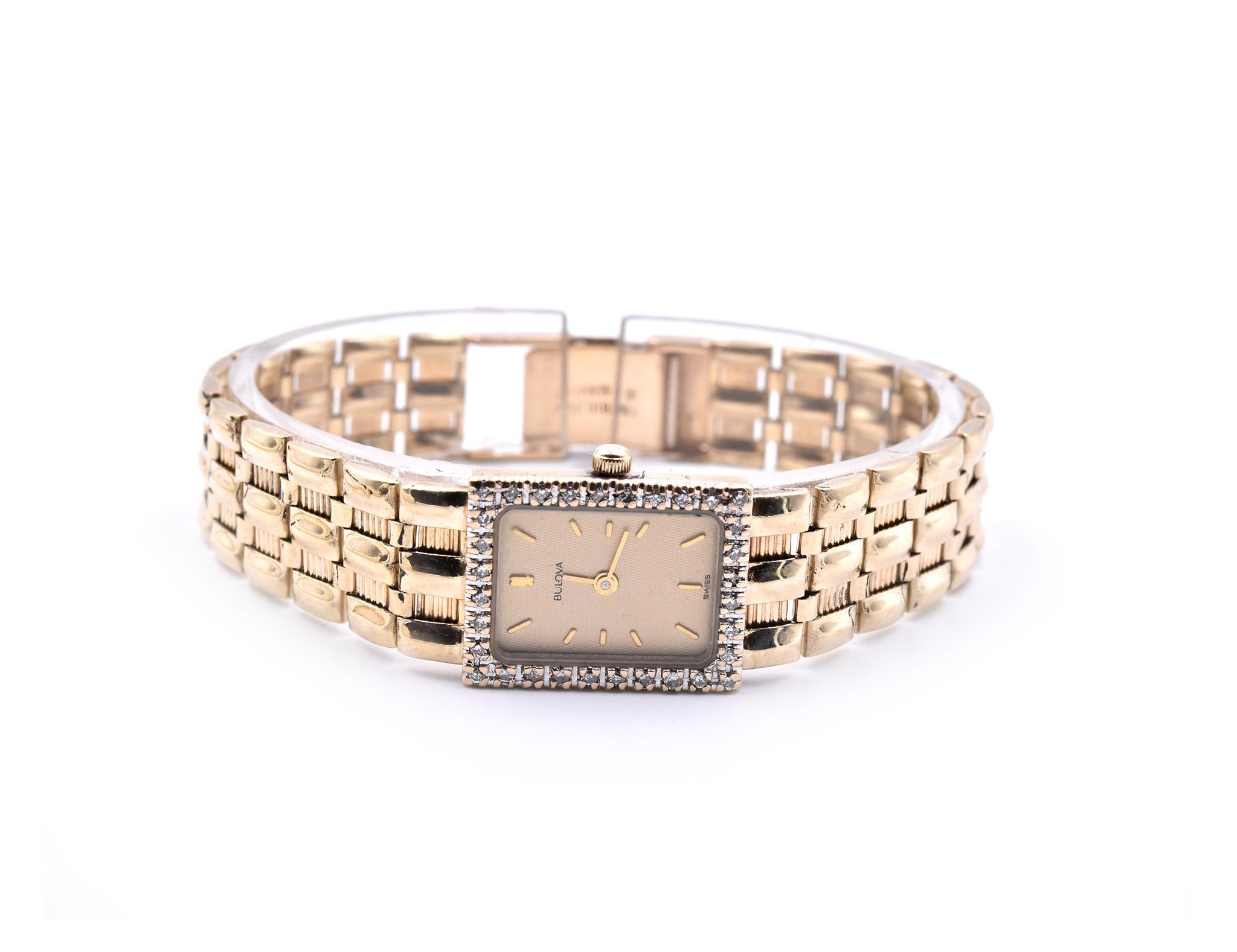 Movement: quartz
Function: hours, minutes, date
Case: 20mm by 15mm rectangular 14k yellow gold case, diamond bezel, plastic protective crystal
Band: 14k yellow gold bracelet will fit a 6 ½-inch wrist with clasp
Dial: gold dial, gold hour stick