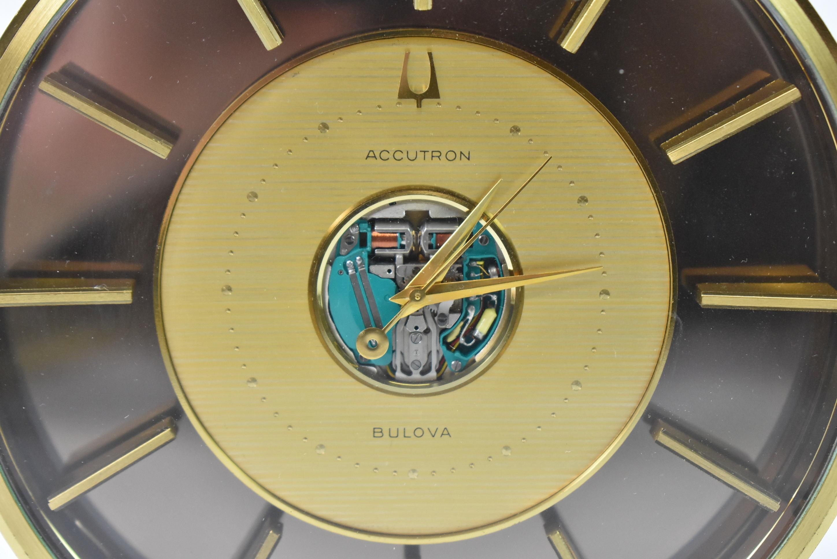 Bulova Accutron Spaceview Desk Clock. Circa 1960's. Floating brass markers on a smoke tone field. All brass frame with a brushed finish. Made in Germany. Great running condition. Dimensions: 6