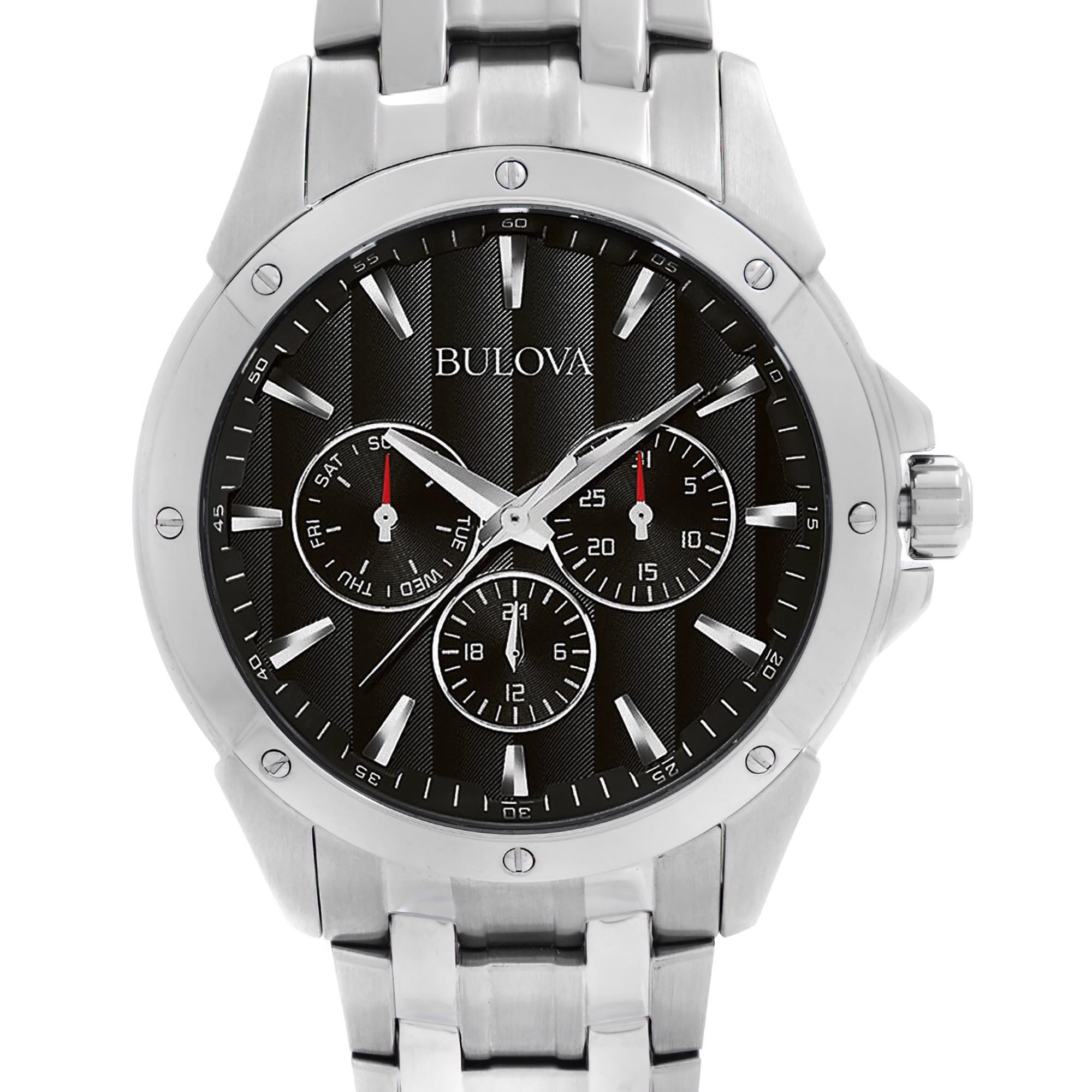 Unworn Bulova Classic 96C107. This Beautiful Timepiece Features: Stainless Steel Case & Bracelet. Black Dial with Silver-Tone Hands and Index Hour Markers. Minute Markers around the outer rim. Three Subdials - Date, Day and 24 Hour. This Watch is