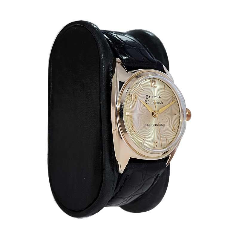 FACTORY / HOUSE: Bulova Watch Company
STYLE / REFERENCE: Art Deco / Round 
METAL / MATERIAL: Yellow Gold Filled 
CIRCA / YEAR: 1954
DIMENSIONS / SIZE: Length 39mm X Diameter 31mm
MOVEMENT / CALIBER: Automatic Winding / 23 Jewels / Caliber 10