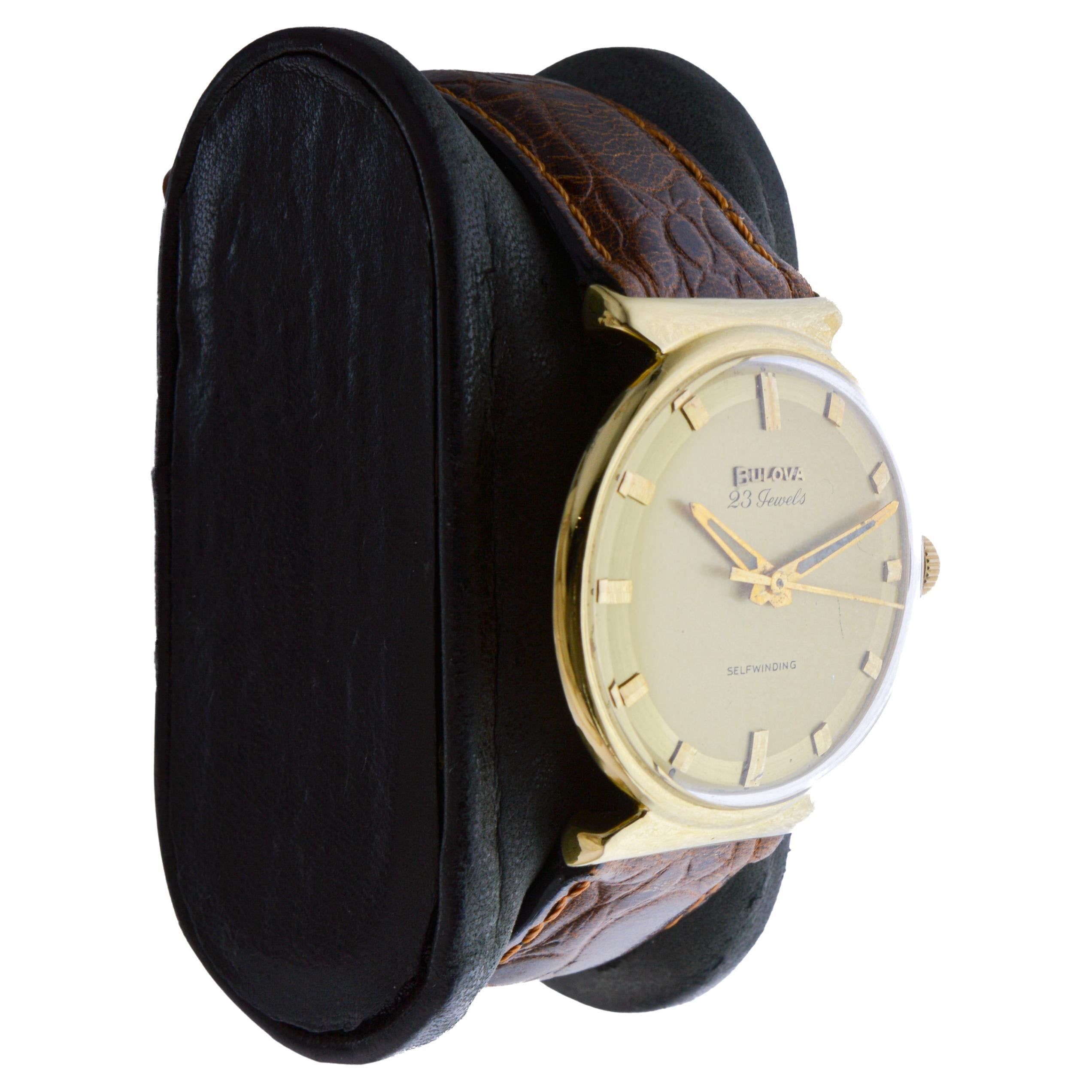 FACTORY / HOUSE: Bulova Watch Company
STYLE / REFERENCE: Mid Century
METAL / MATERIAL: Yellow Gold Filled
CIRCA / YEAR: 1963
DIMENSIONS / SIZE: Length 36mm X Diameter 32mm
MOVEMENT / CALIBER: Automatic Winding / 23 Jewels 
DIAL / HANDS: Factory