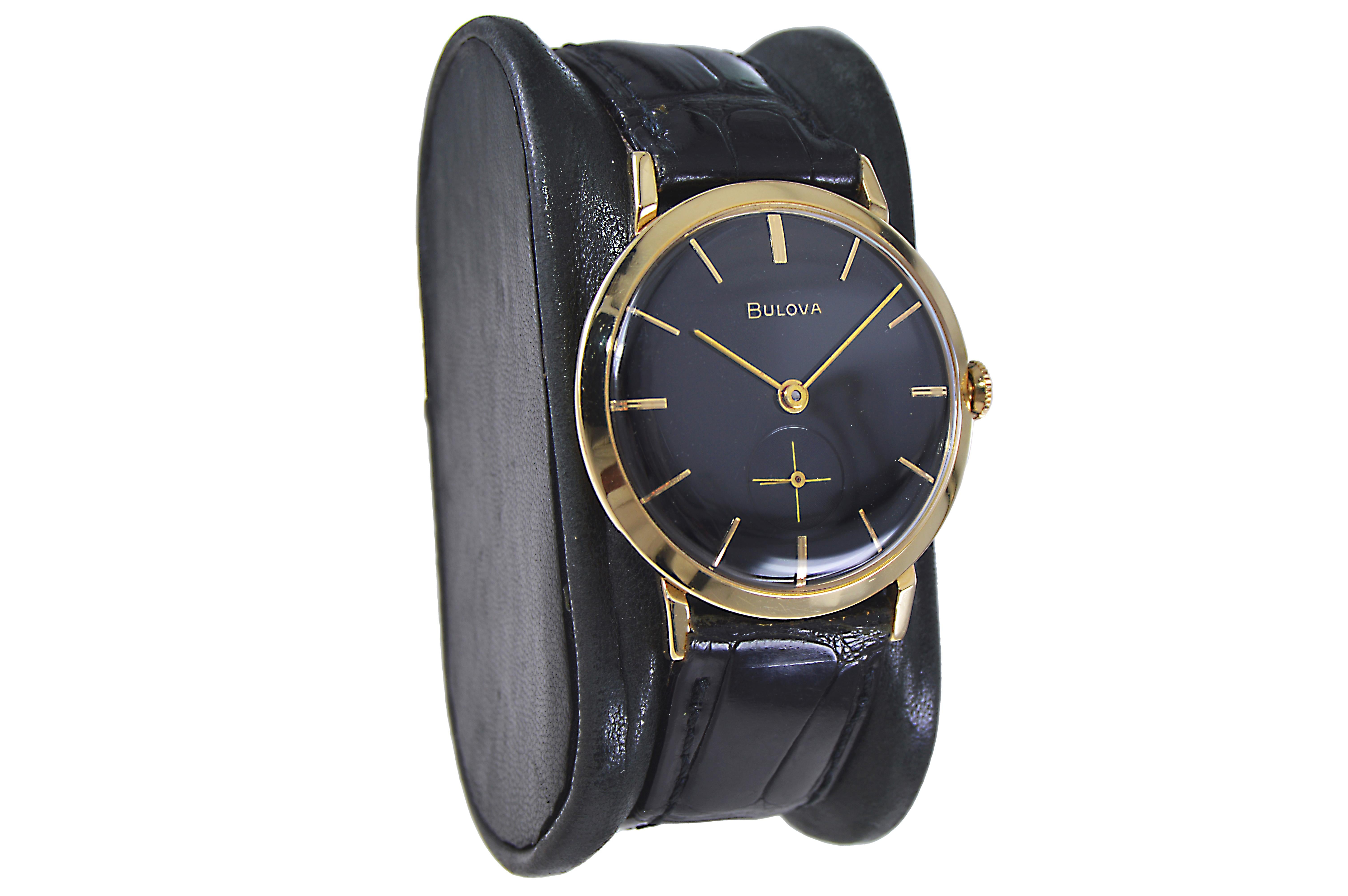 FACTORY / HOUSE: Bulova Watch Company
STYLE / REFERENCE: Round Dress Style 
METAL / MATERIAL: 14Kt. Solid Gold 
CIRCA / YEAR: 1960's
DIMENSIONS / SIZE: 38mm x 33mm
MOVEMENT / CALIBER: Manual Winding / 21 Jewels 
DIAL / HANDS: Black with Baton