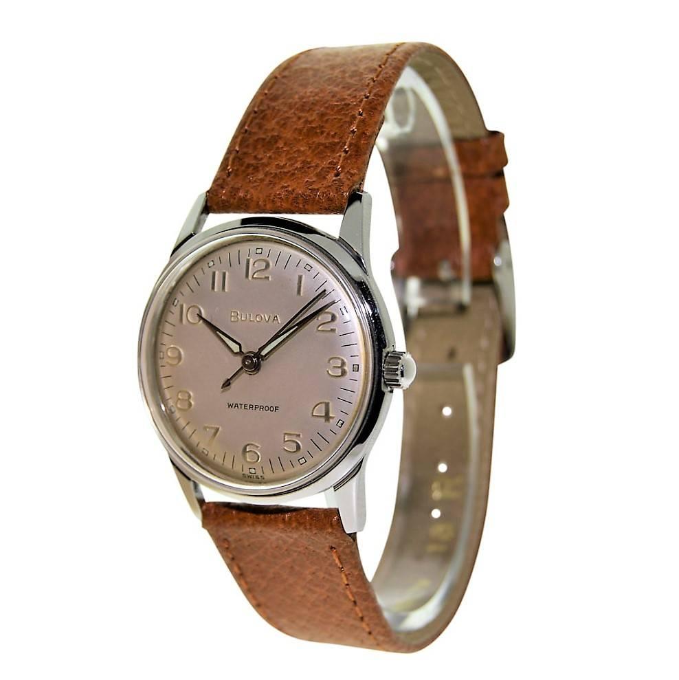 FACTORY / HOUSE: Bulova Watch Company
STYLE / REFERENCE: Round / Moderne
METAL / MATERIAL: Stainless Steel 
CIRCA: 1960's
DIMENSIONS: 37 mm X 31 mm
MOVEMENT / CALIBER: Manual Winding / 17 Jewels 
DIAL / HANDS: Original Silvered with luminous Arabic