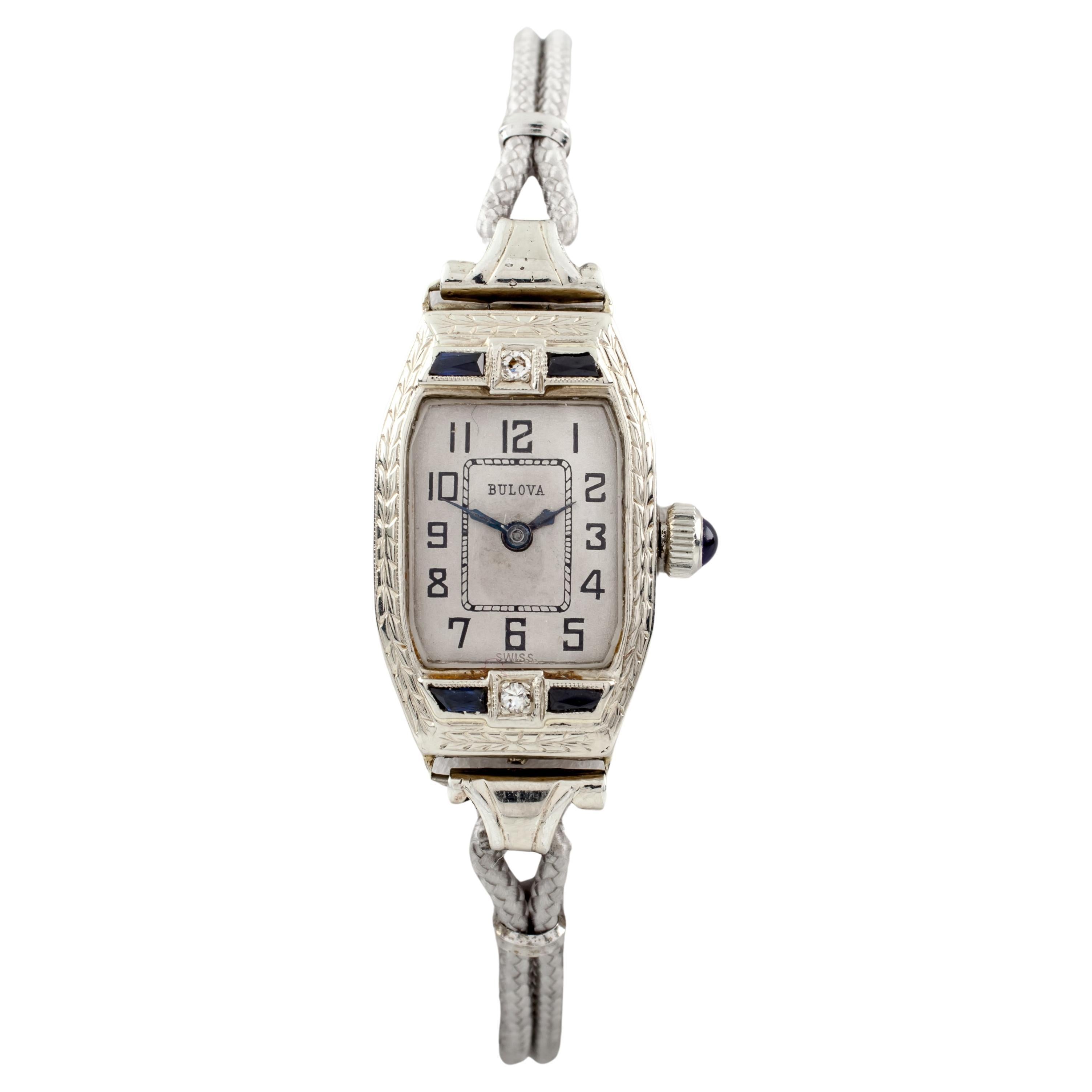 Bulova Montre vintage en or blanc 14 carats à remontage manuel avec bracelet en cordon gris, pour femmes