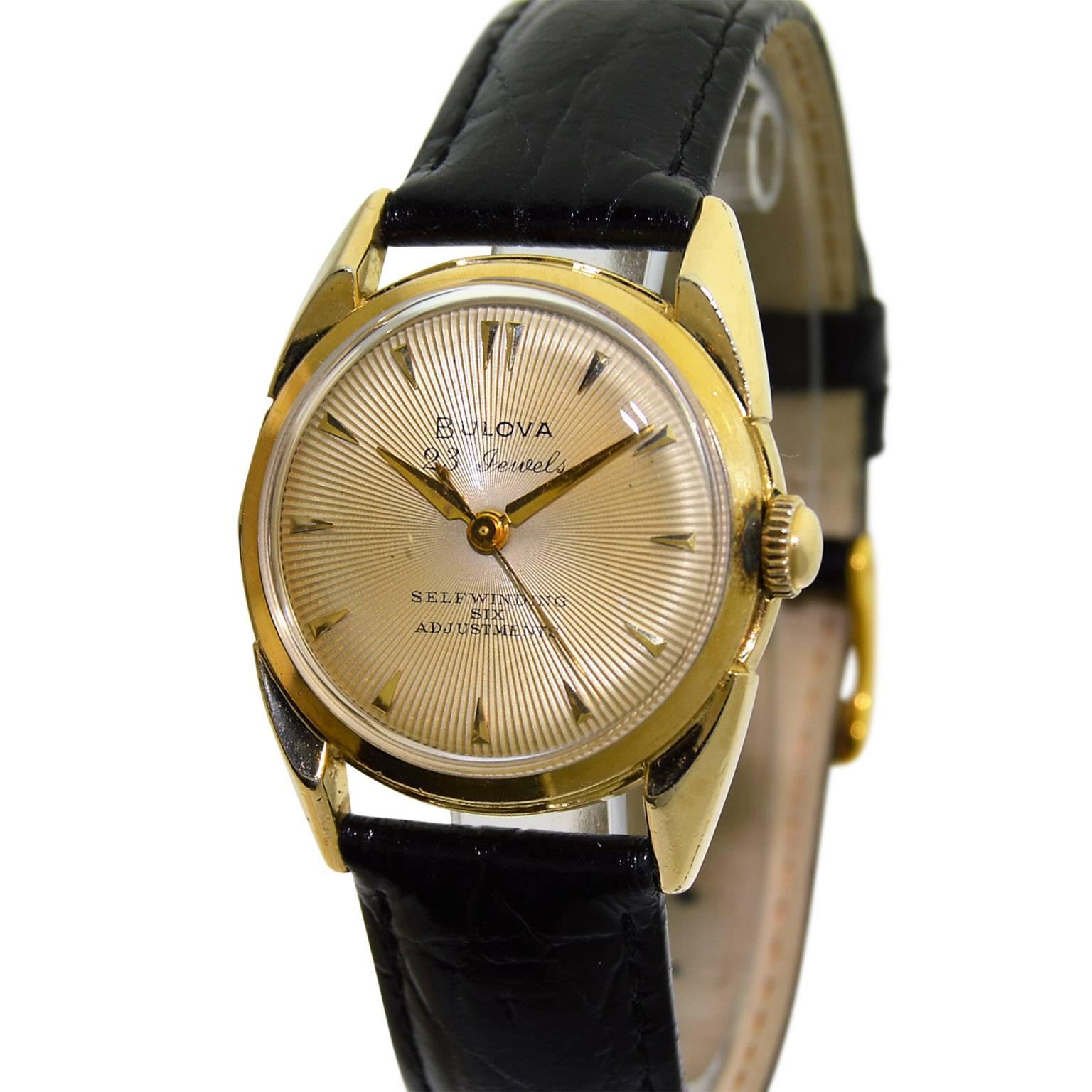 FACTORY / HOUSE: Bulova Watch Company
STYLE / REFERENCE: Art Deco 
METAL / MATERIAL:  14Kt. Yellow Gold Filled
CIRCA: 1960's
DIMENSIONS: 38mm X 31mm
MOVEMENT / CALIBER: Automatic Winding / 23 Jewels 
DIAL / HANDS: Silvered Engine Turned with Applied