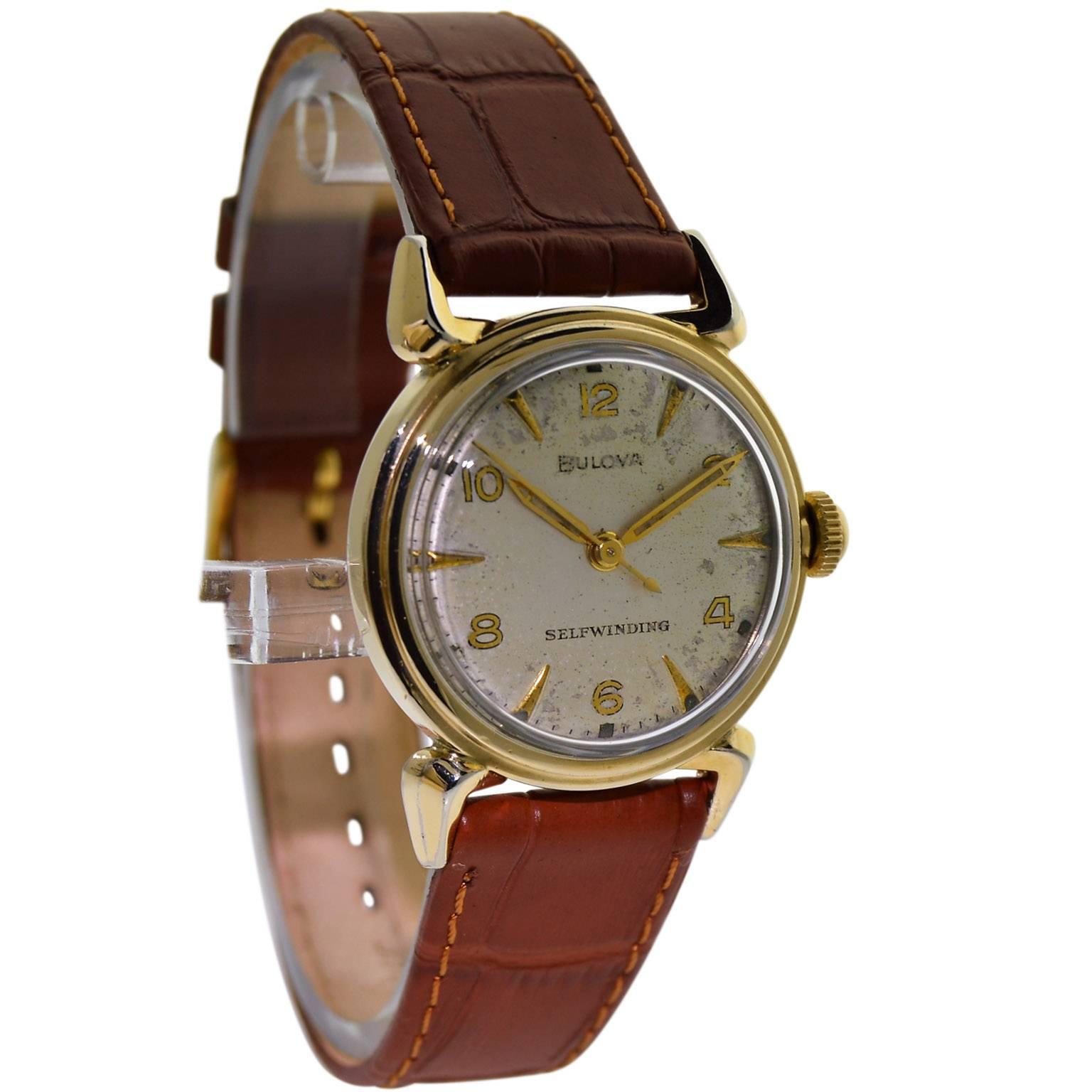 FACTORY / HOUSE: Bulova Watch Company
STYLE / REFERENCE: Round / Art Deco
METAL / MATERIAL: 14Kt. Yellow Gold Filled
CIRCA: 1960's
DIMENSIONS: 40mm X 31mm
MOVEMENT / CALIBER: Selfwinding /17 Jewels 
DIAL / HANDS: Original Silvered Quartered /