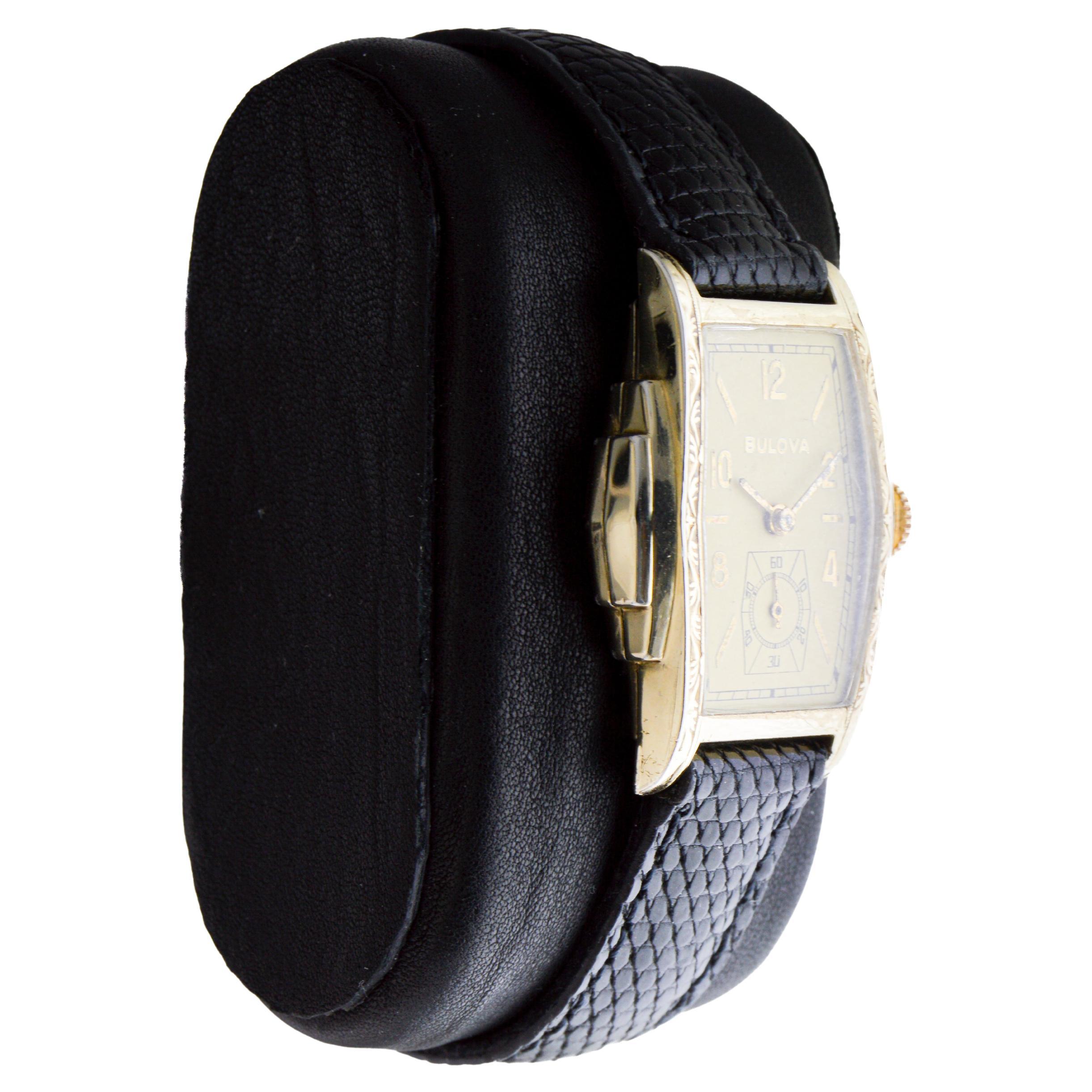 FACTORY / HOUSE: Bulova Watch Company
STYLE / REFERENCE: Art Deco / Tonneau Shape
METAL / MATERIAL: Yellow Gold Filled
CIRCA / YEAR: 1940's
DIMENSIONS / SIZE: Length 36mm 