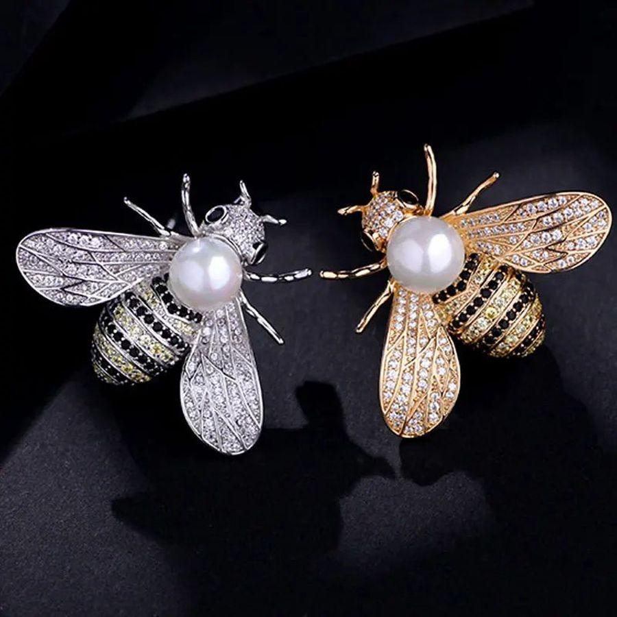 Simply Beautiful! Pair of Bumble Bee Vintage Brooch Pins. Each Brooch encrusted with Hand set Sparkling Crystals and with a Faux Pearl enhancing the Wings and Body. Hand crafted Gold and Silver tone mountings. Measures approx. 1.0” L x 1.5” W. More