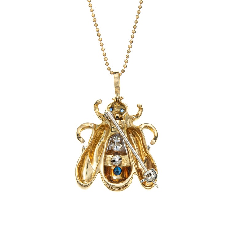 Stylish and finely detailed vintage diamond bumble bee pendant & necklace crafted in 18k yellow gold.
Cabochon cut sapphires range in size from 1mm to 3mm. The diamonds total an estimated 0.12 carats (estimated at G-H color and VS2 clarity). 

The