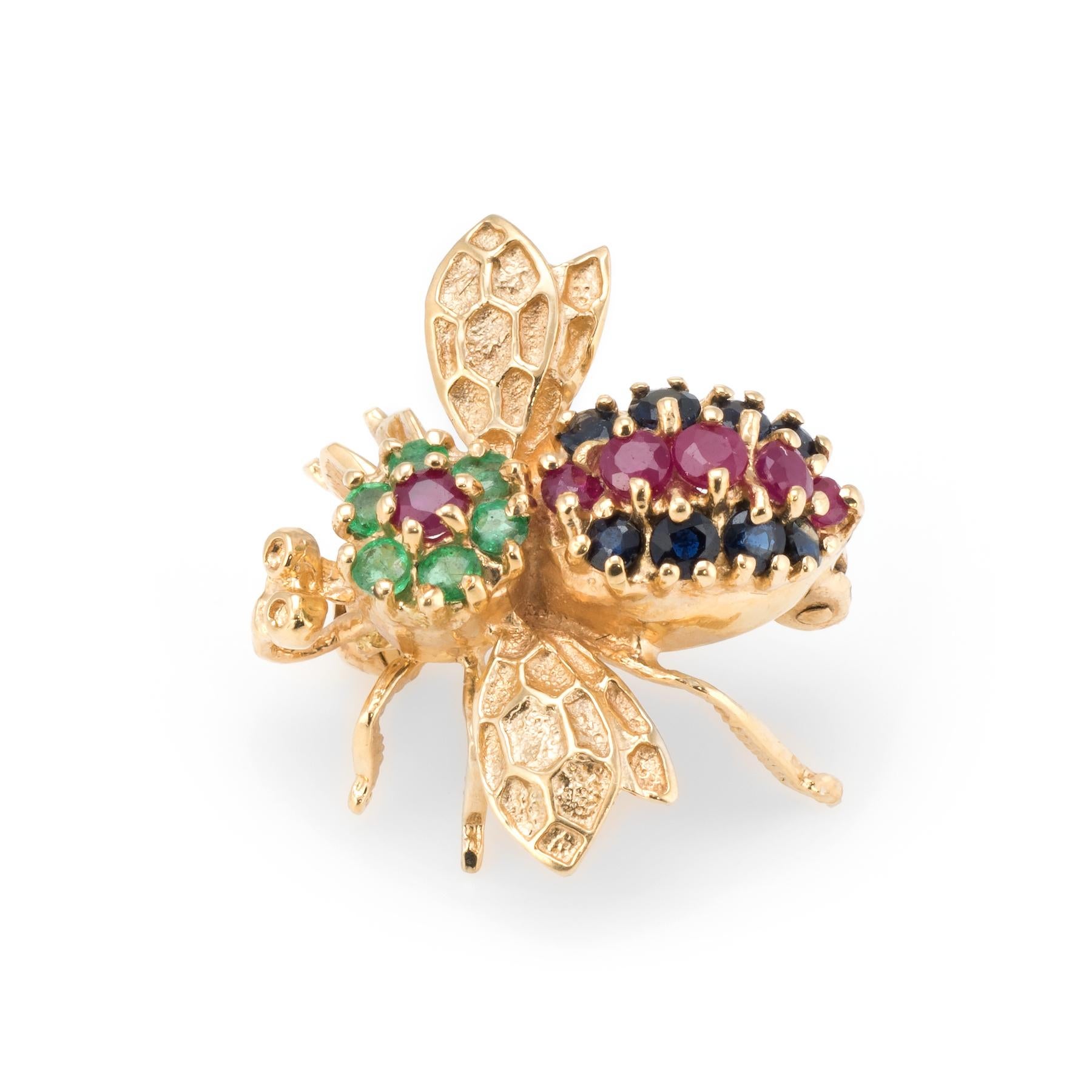 Finely detailed vintage bumble bee brooch, crafted in 14 karat yellow gold.  

Sapphires total an estimated 0.16 carats, emeralds total an estimated 0.12 carats and rubies total an estimated 0.12 carats. The gemstones are in excellent condition free
