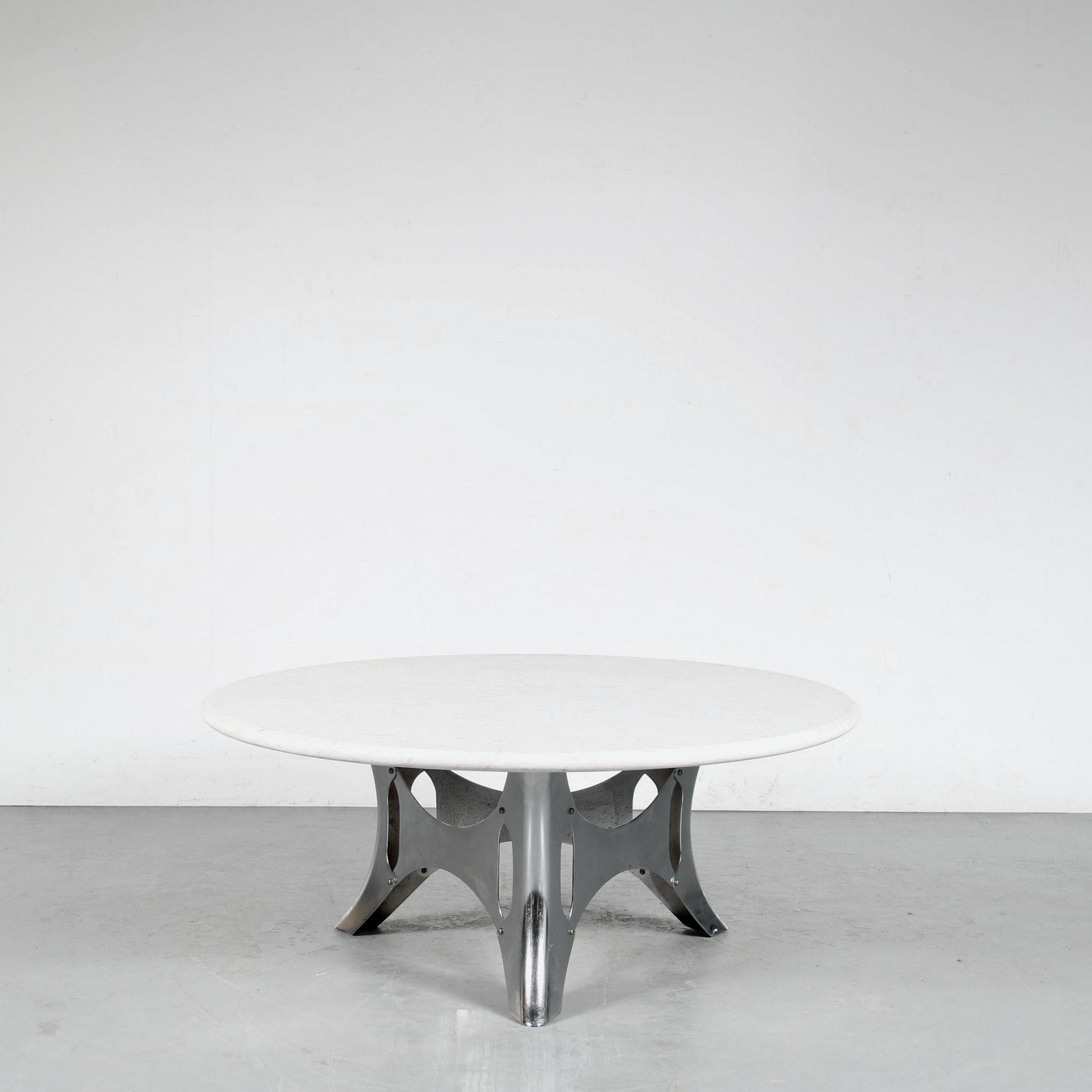 This is a rare “Bumper” Table by Dutch designer Martin Visser, manufactured by ‘t Spectrum in the Netherlands around 1960.

This is one of Visser’s most unique pieces, designed as a modern version of a baroque table design. The chrome plated metal