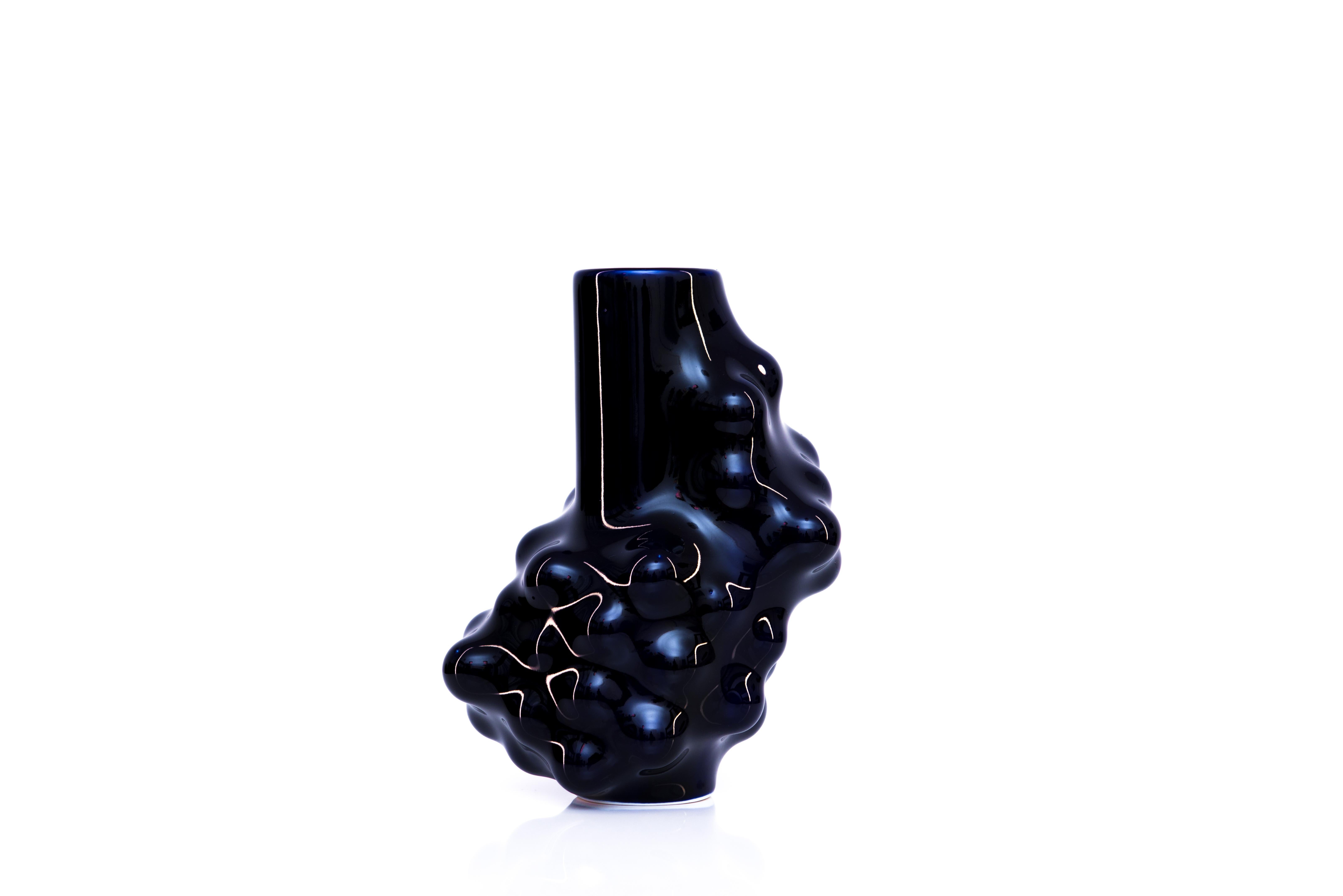 Bumps 2.0 cobalt blue carafe by Arkadiusz Szwed
Dimensions: L 14 x W 13 x H 20 cm
Materials: Porcelain

Arkadiusz Szwed designs and produce ceramic products.
He lives in Warsaw / Poland and work at the School of Form as an Instructor and Head