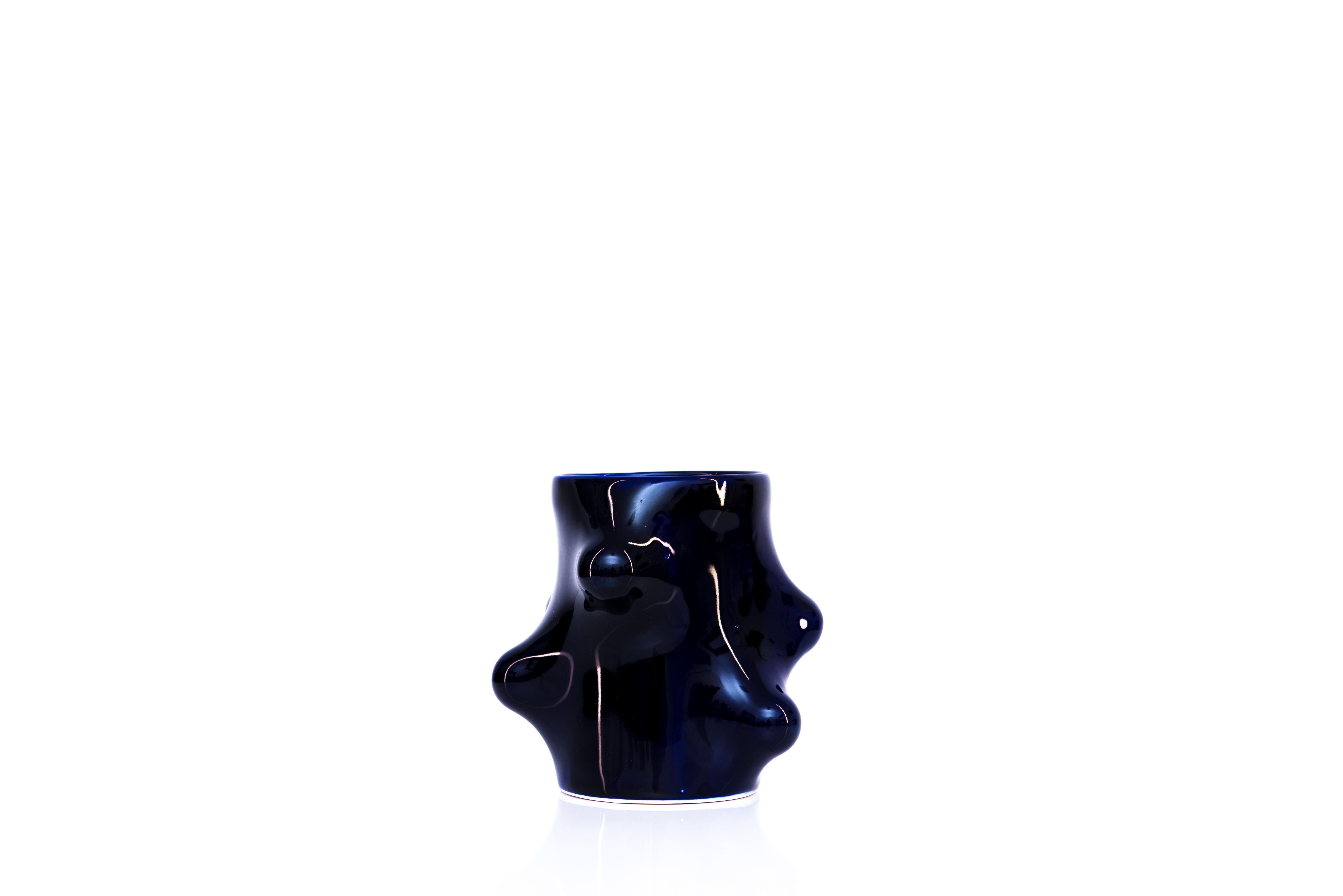 Bumps 2.0 cobalt blue cup by Arkadiusz Szwed
Dimensions: L 11 x W 11 x H 12 cm
Materials: Porcelain

Arkadiusz Szwed designs and produce ceramic products.
He lives in Warsaw / Poland and work at the School of Form as an Instructor and Head of
